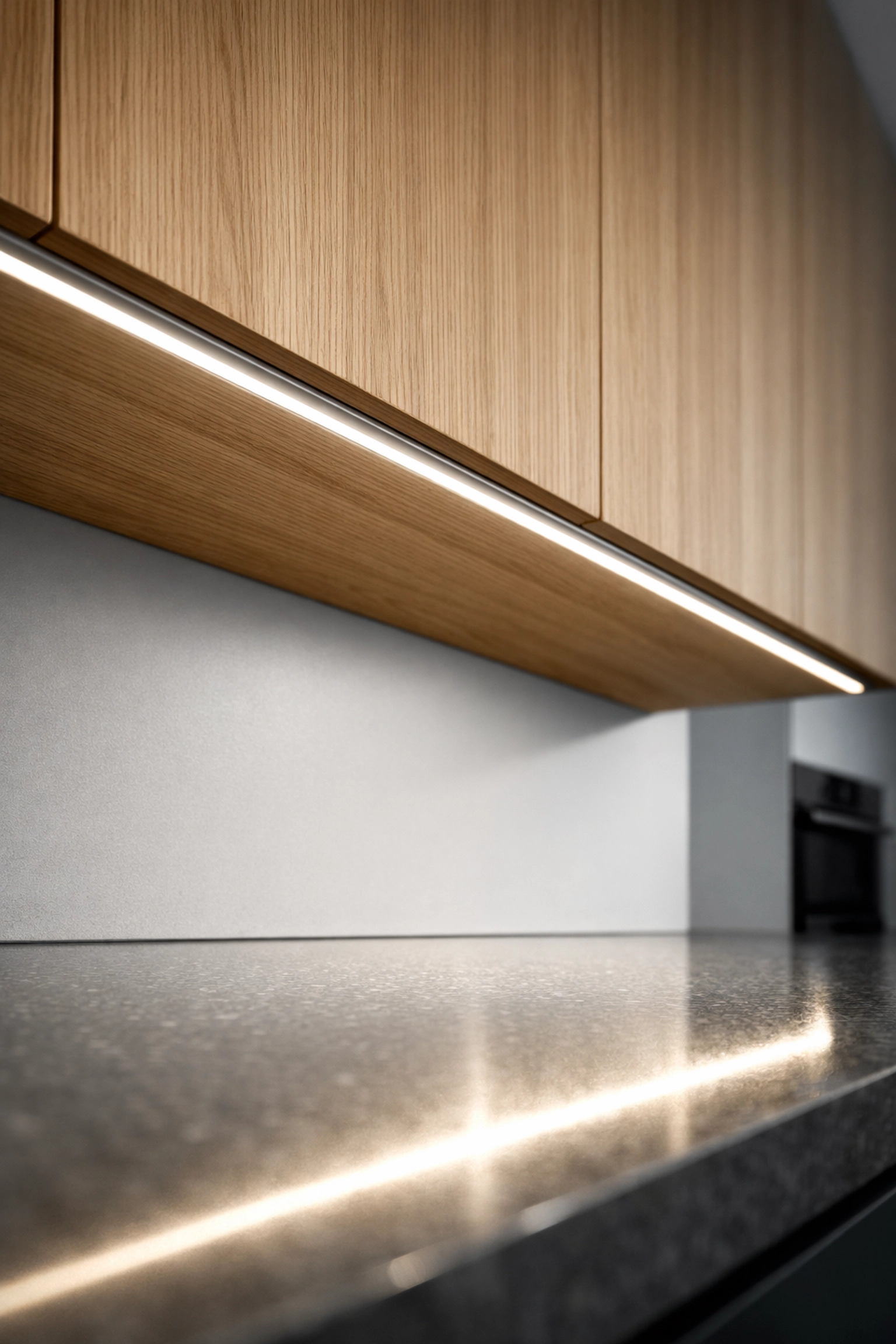 Under cabinet LED channel providing seamless dot-free lighting on a modern quartz countertop.
