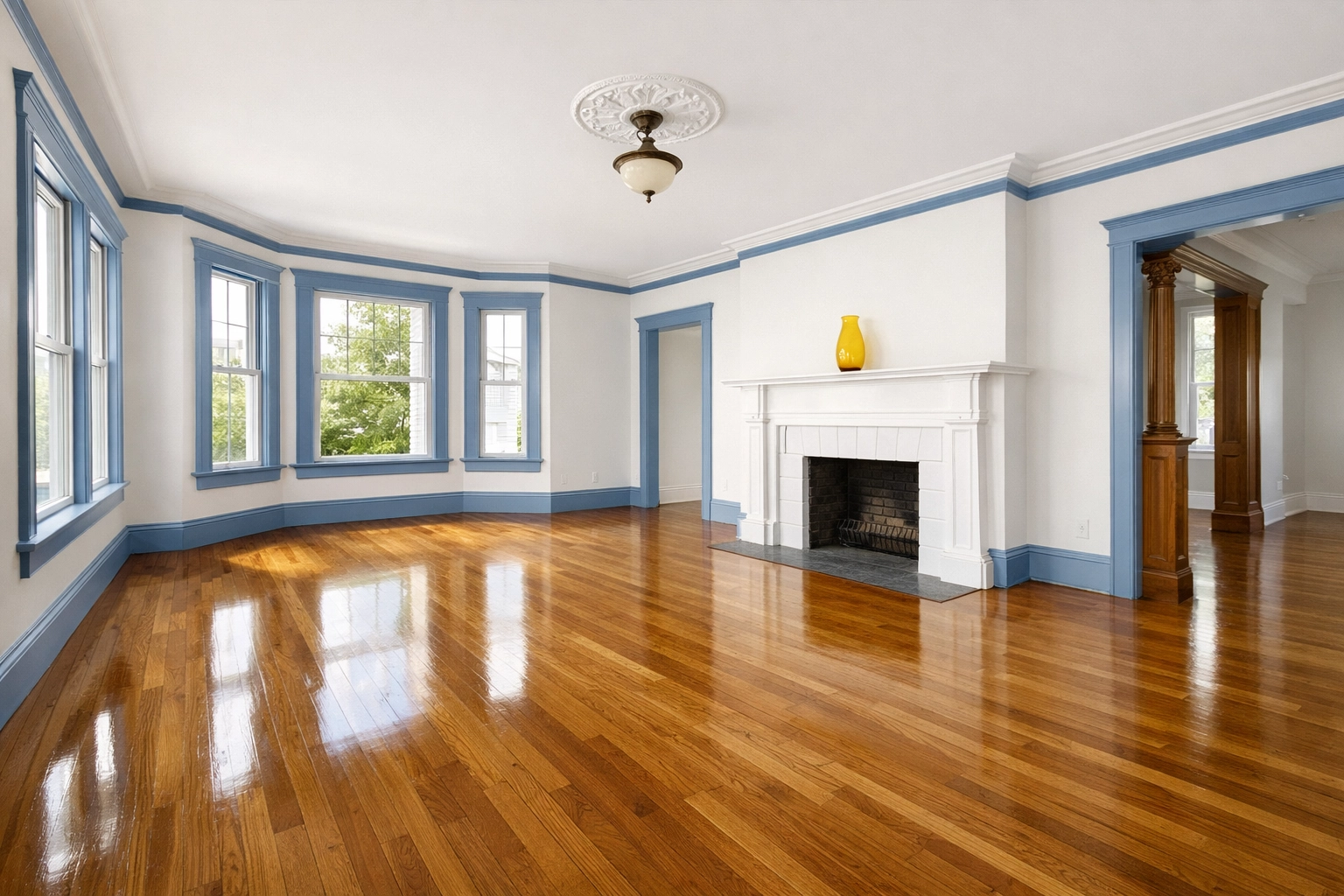 Empty living room with polished floors after a professional move-out cleaning Worcester MA.