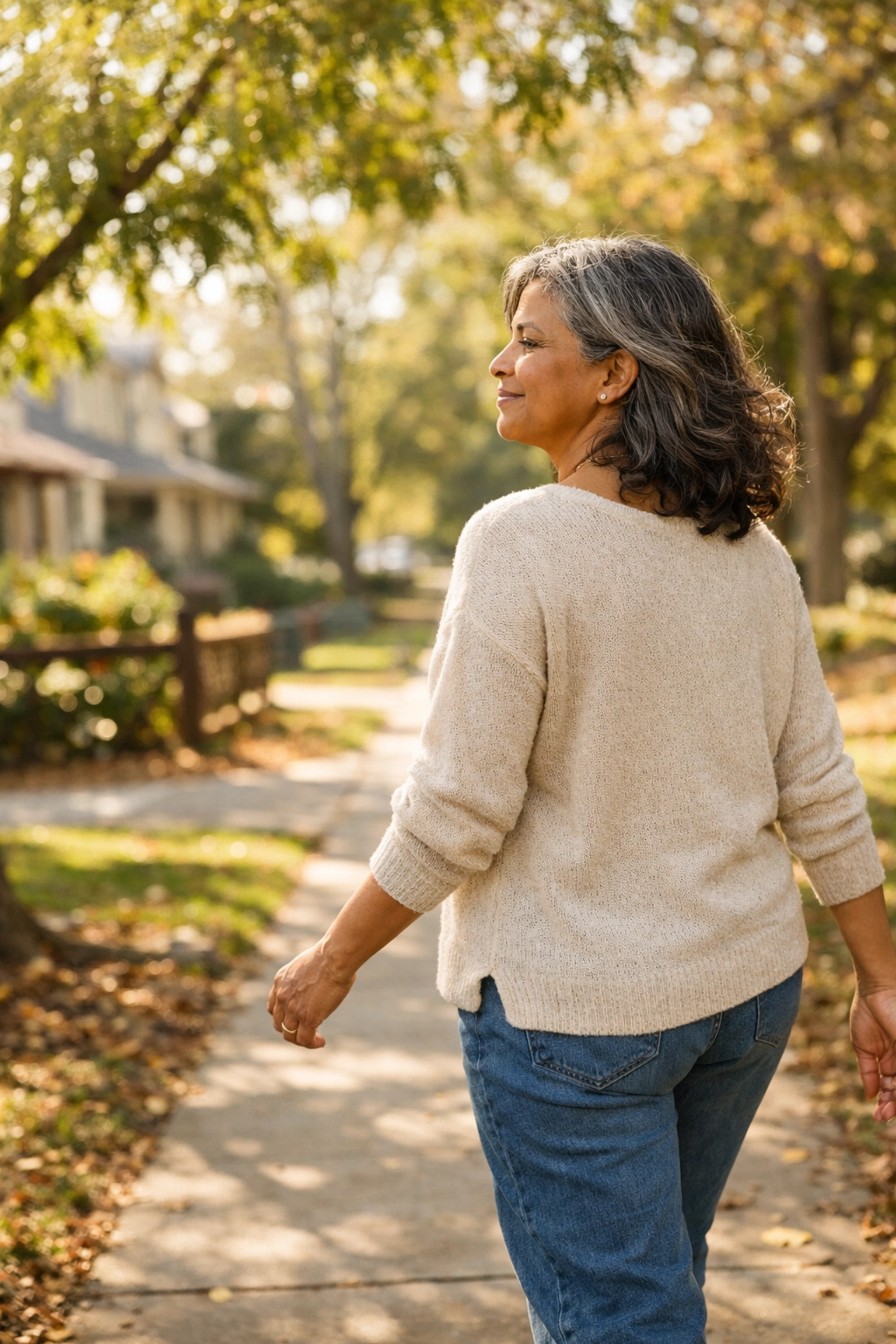 Woman entrepreneur taking mindful walk outdoors for stress management and simple movement