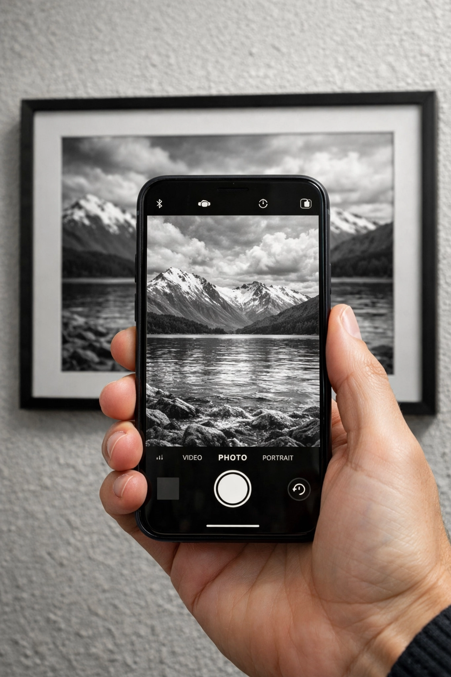 Smartphone camera recognizing a landscape photo to trigger interactive digital content without QR codes.