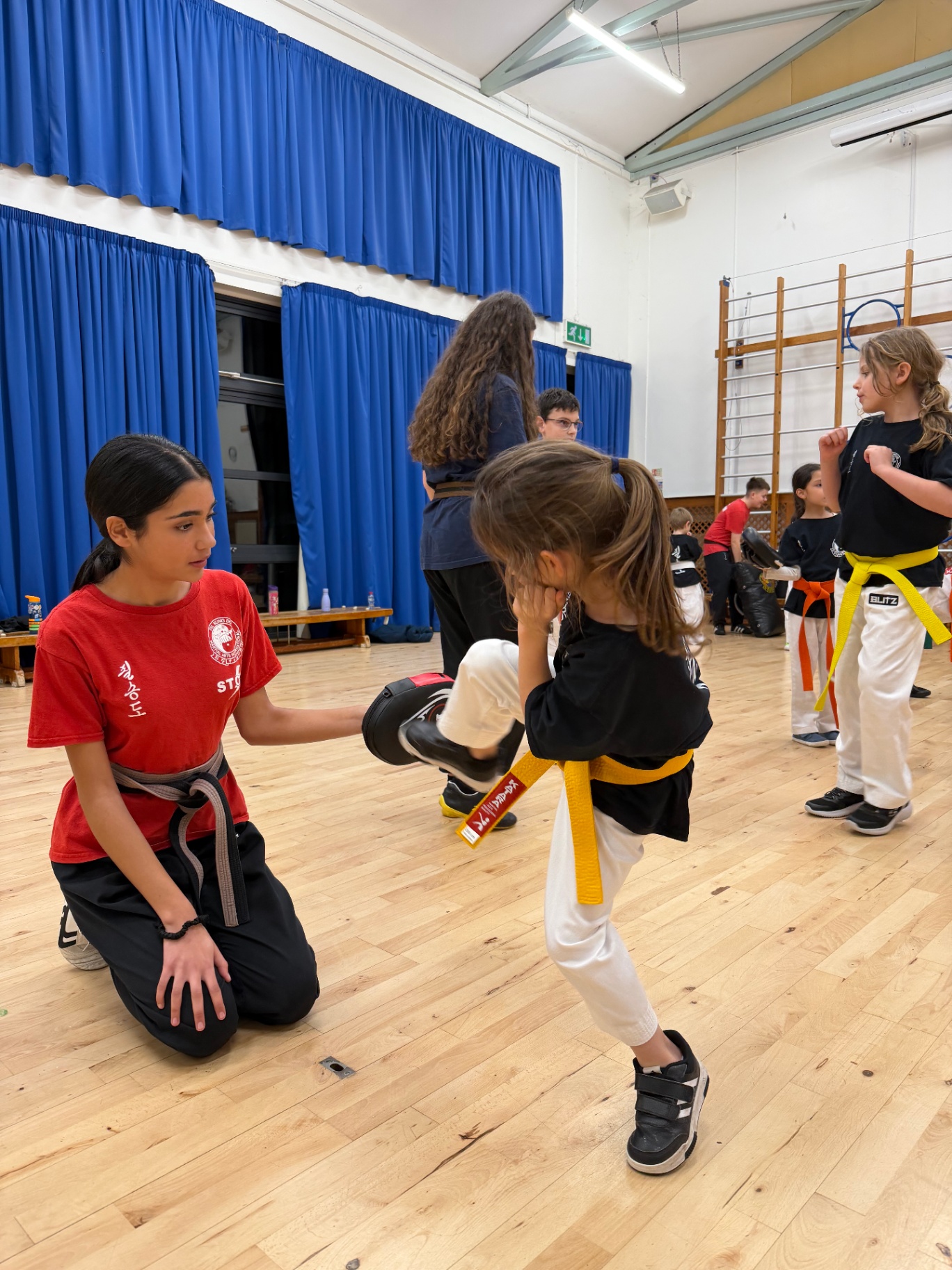 Instructor helping a child