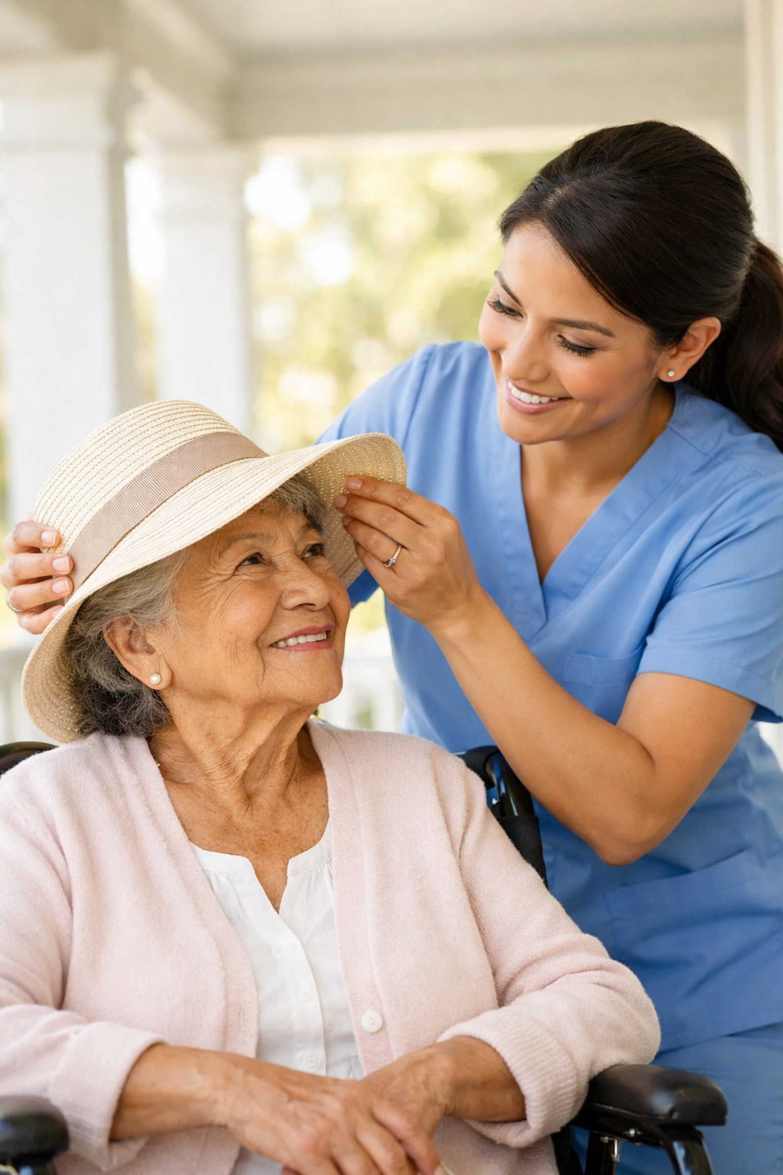 Caregiver helping a senior in a wheelchair on a porch, promoting safe outdoor aging in Fauquier County.