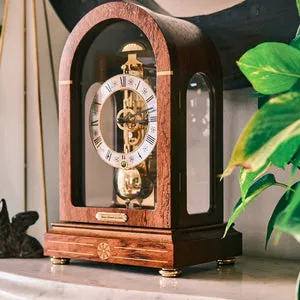 Elegant Hermle mantel clock with a visible gold-tone skeleton movement