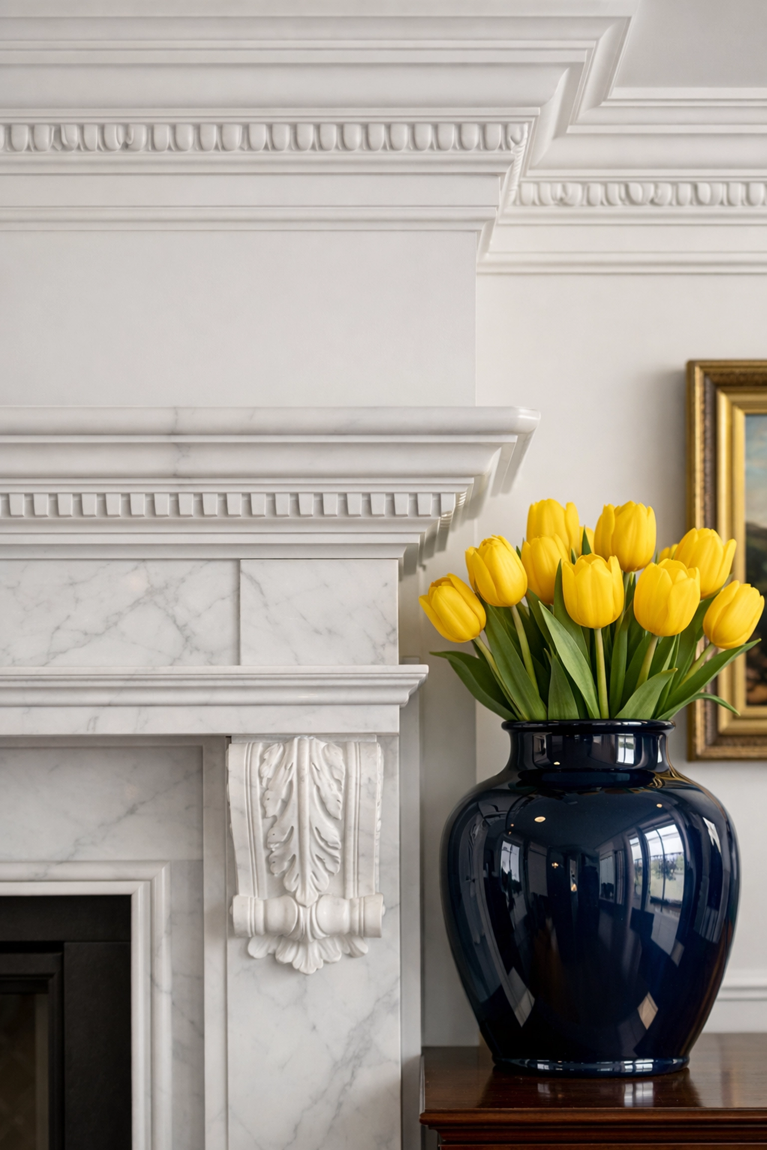 Pristine white marble fireplace and clean crown molding in a Brookline home, showcasing luxury house cleaning.