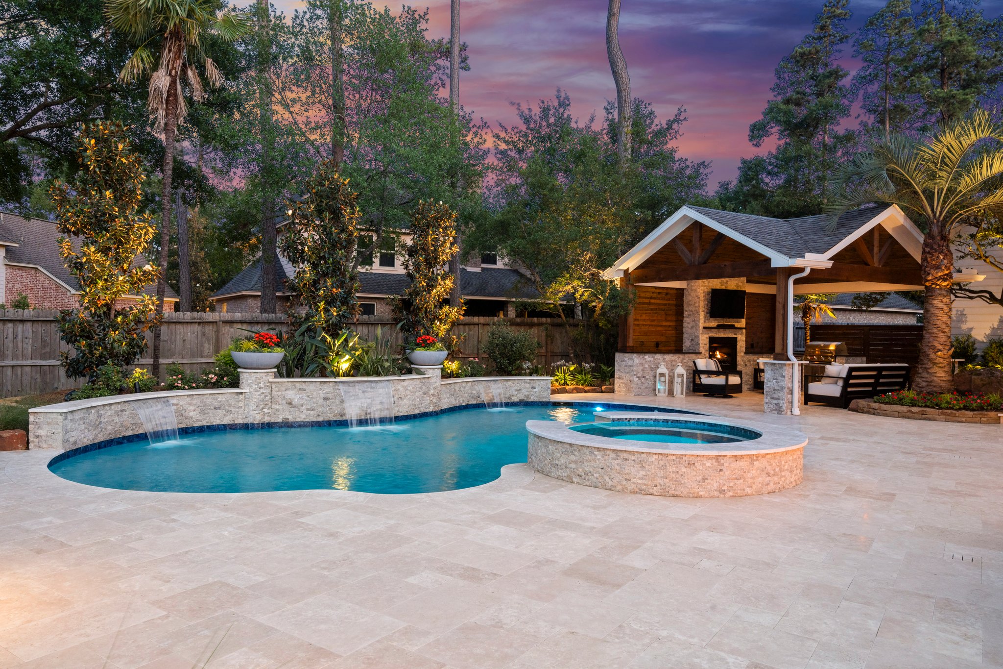 Evening social vibes with custom pool lighting and relaxation areas
