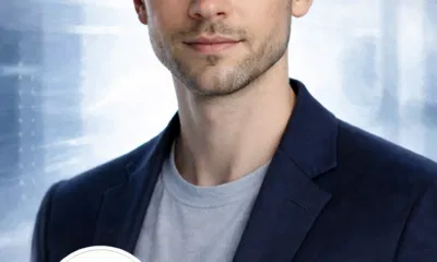 Young professional man in blue urban background