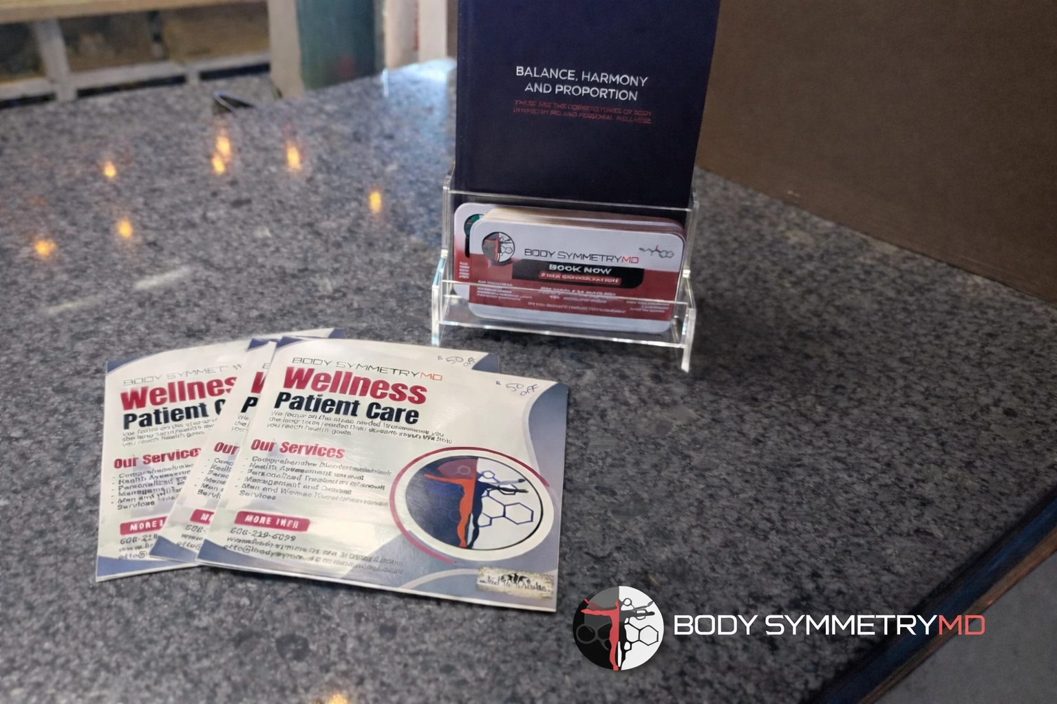 Wellness materials at Body Symmetry MD highlighting Medical Weight Loss and Hormone Therapy.