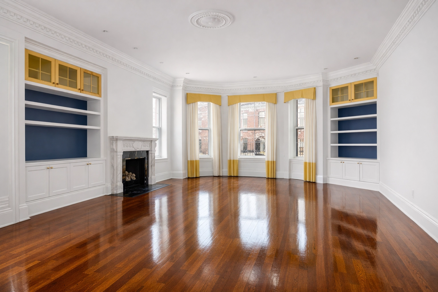 Clean, empty Boston apartment living room with polished floors after a professional move-out cleaning.