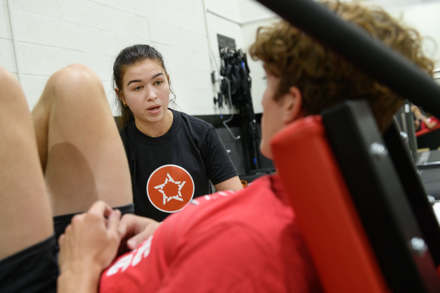 Youth athletes training strength on the plyo press/leg press machine at Athletic Republic Knoxville