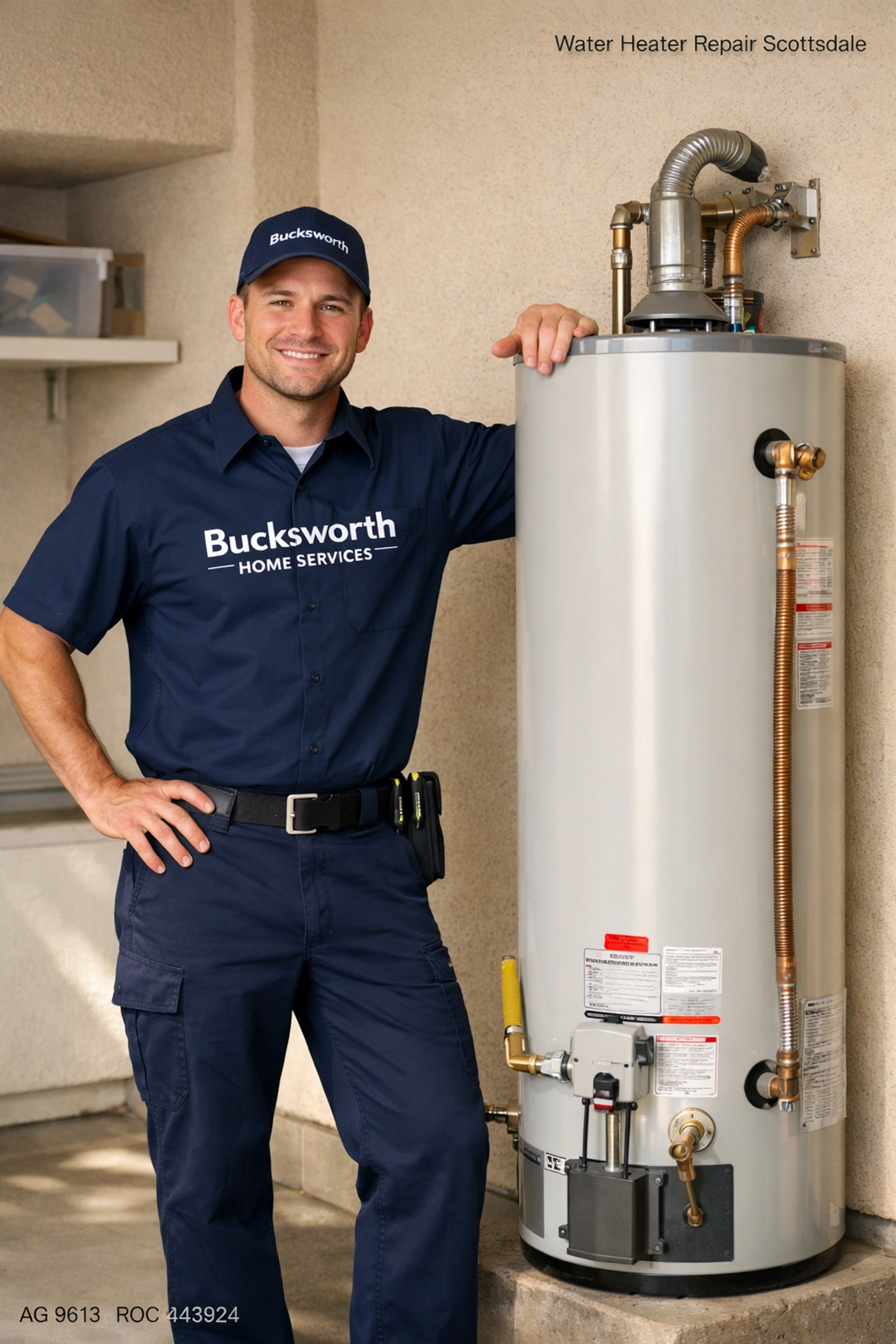 Professional Bucksworth technician inspecting a residential tank water heater in a Scottsdale, AZ home garage.