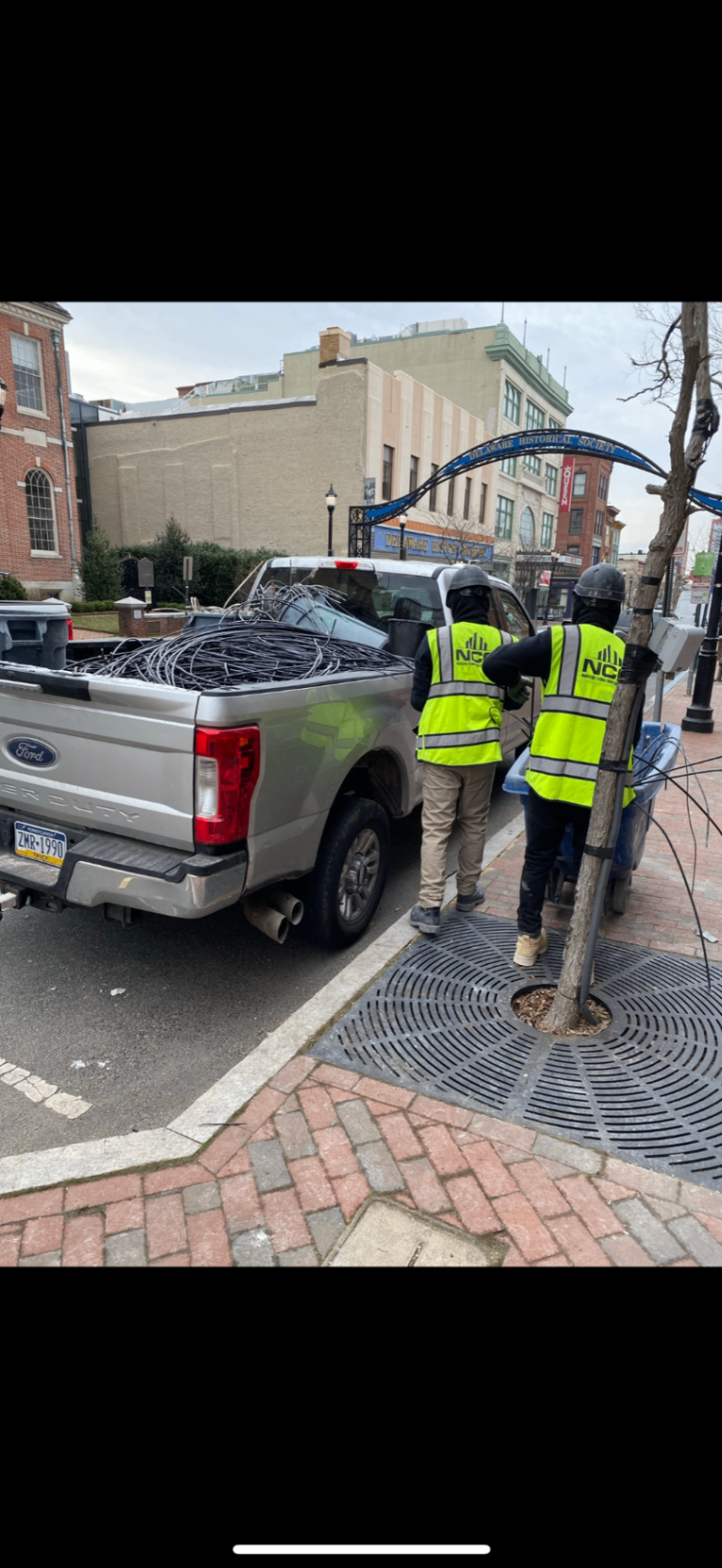 Narcise Construction Group Crew Loading Debris