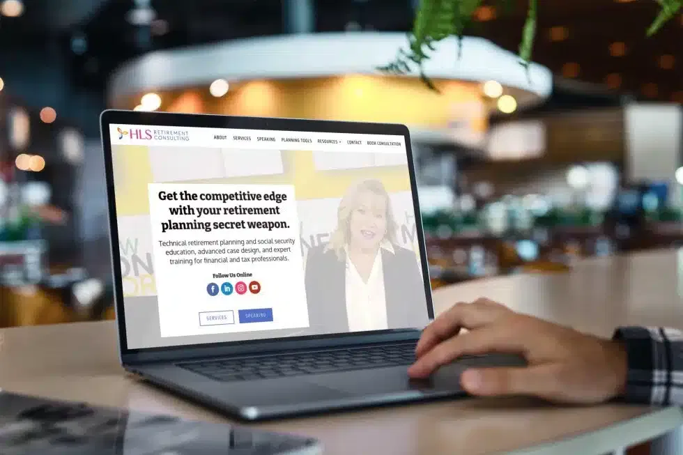 A laptop displaying a professionally designed consulting website, highlighting JJ Social Light’s expertise in creating strong online presences