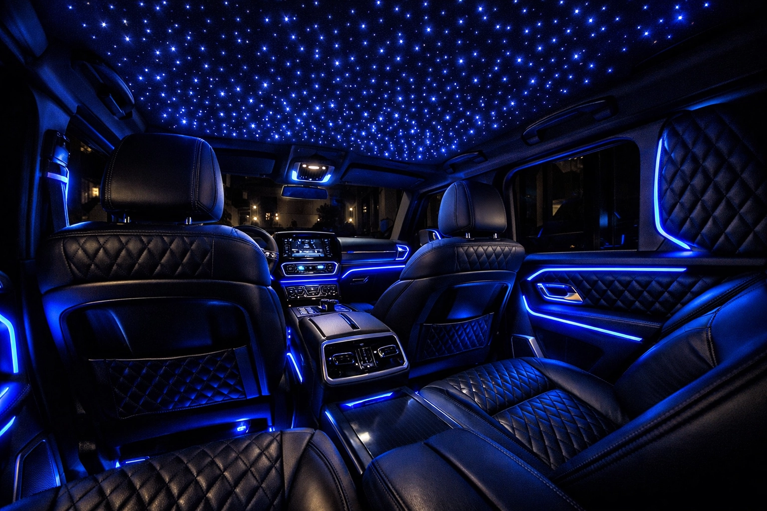 Custom truck lighting with a blue starlight fiber-optic ceiling in a luxury vehicle interior.