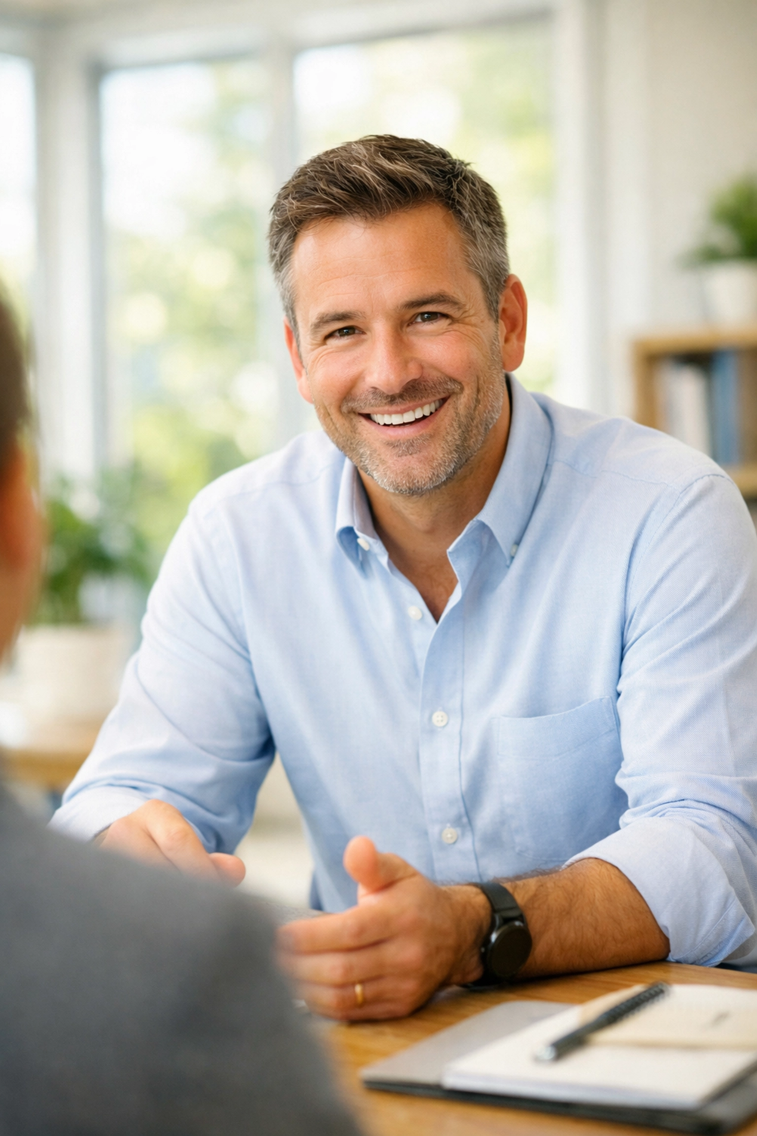 A friendly insurance expert ready for a VitalShield Wealth Shield consultation about IUL.