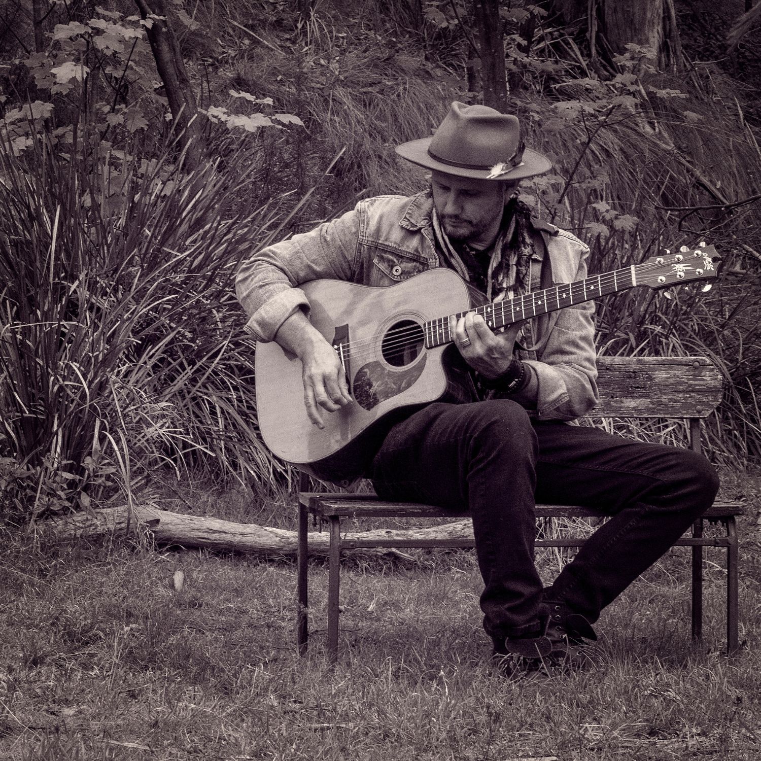 Ben Drysdale Music Outdoors Singer-songwriter seated outdoors
