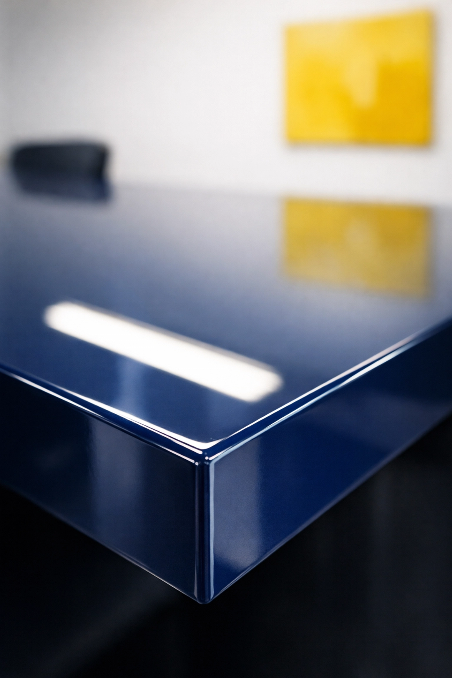 Close-up of a polished blue conference table showing high-end professional cleaning details.