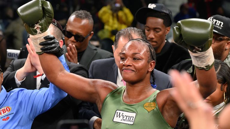 Claressa Shields celebrates the win in her green uniform, soaking up that high-energy Detroit moment