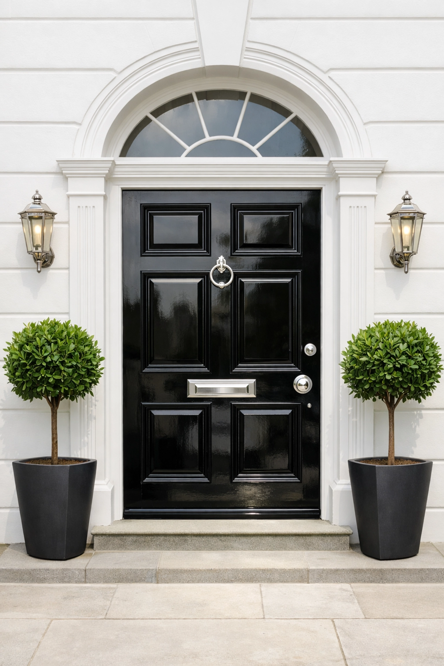 Classic Cheltenham Regency front door with black gloss finish and fresh white masonry paint.