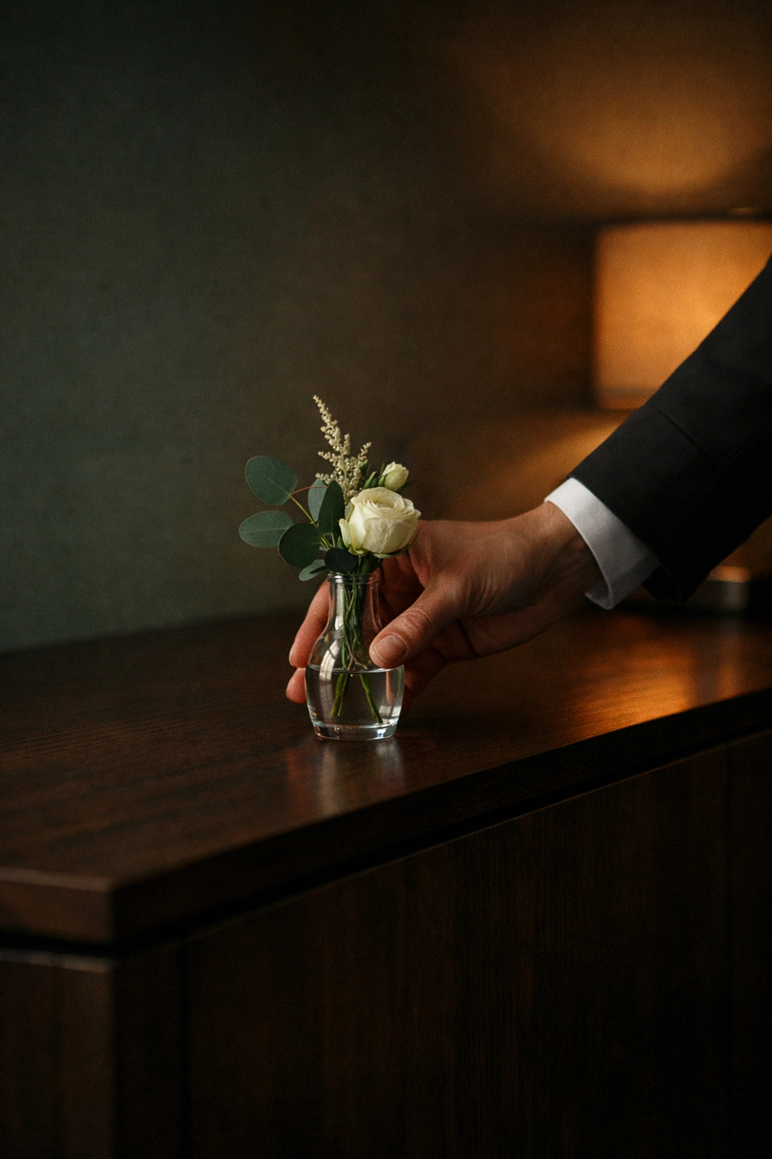 Hotel staff placing a personalized welcome gift, showing the human touch in AI-powered hospitality.