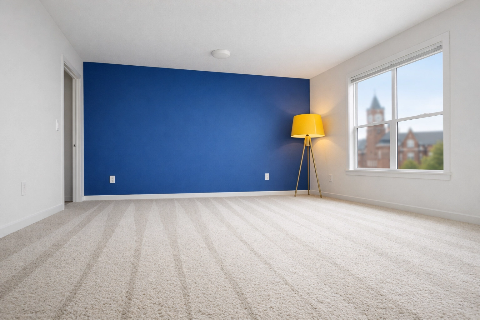 Empty Lowell apartment near UMass featuring fresh vacuum lines after professional move-out cleaning.