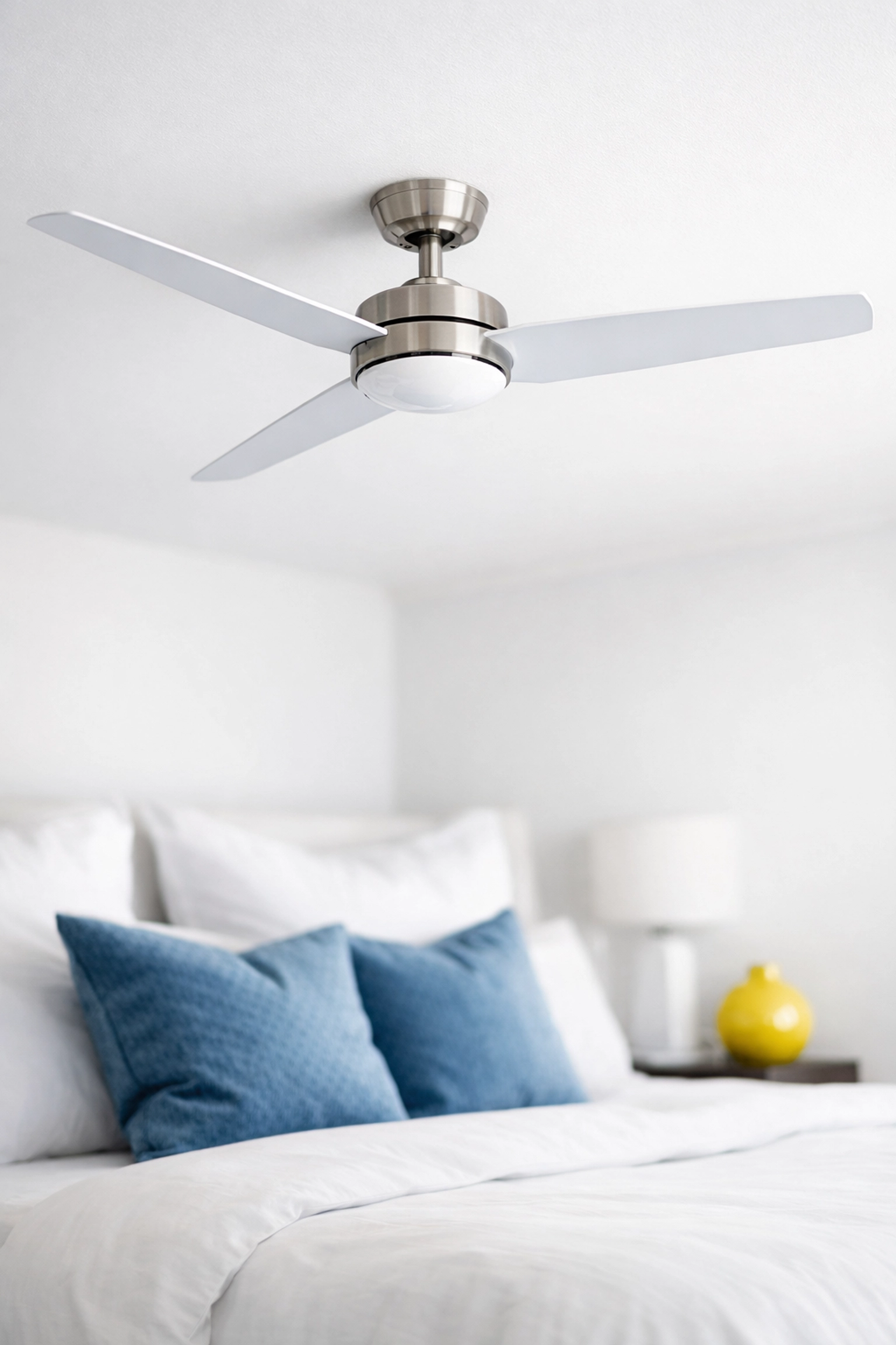 Dust-free ceiling fan blades in a modern bedroom reflecting professional house cleaning standards.
