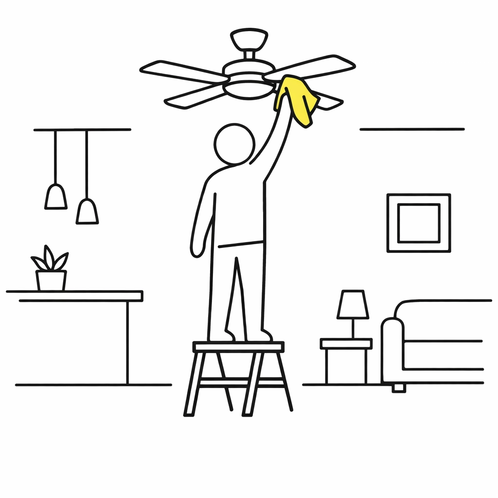 A homeowner cleaning a ceiling fan as part of a spring maintenance routine.
