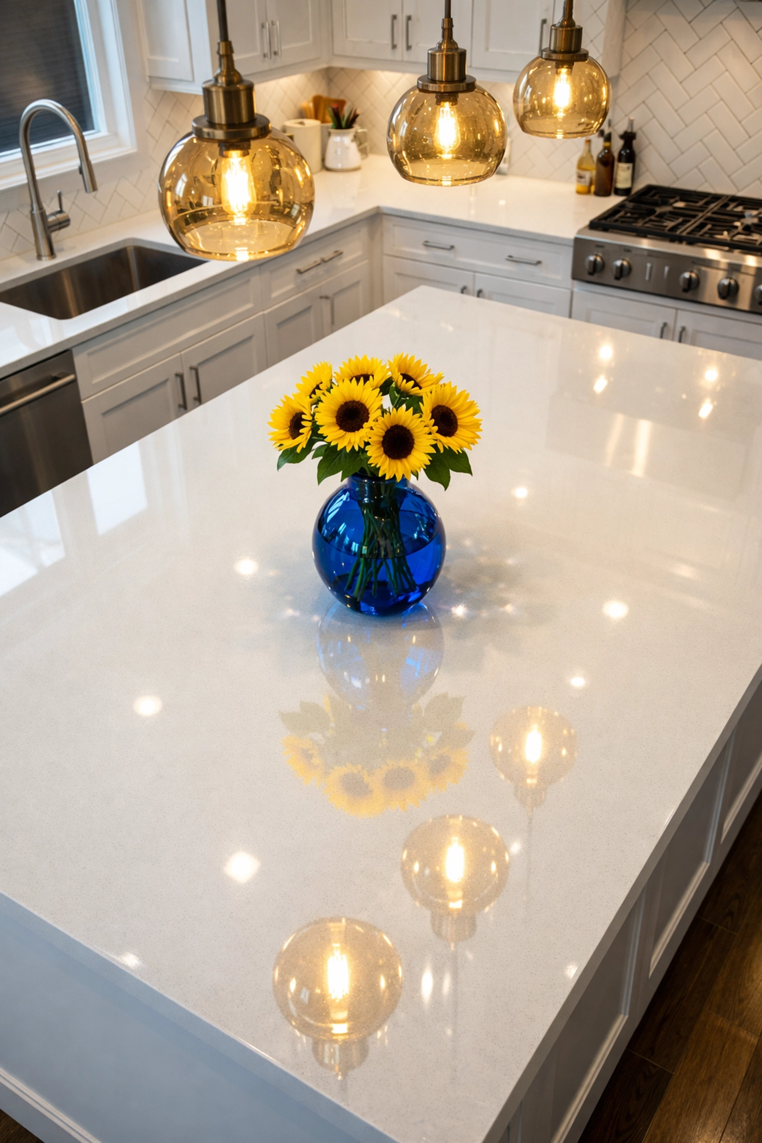 Shiny quartz kitchen island showing the results of professional deep cleaning in Leominster MA.