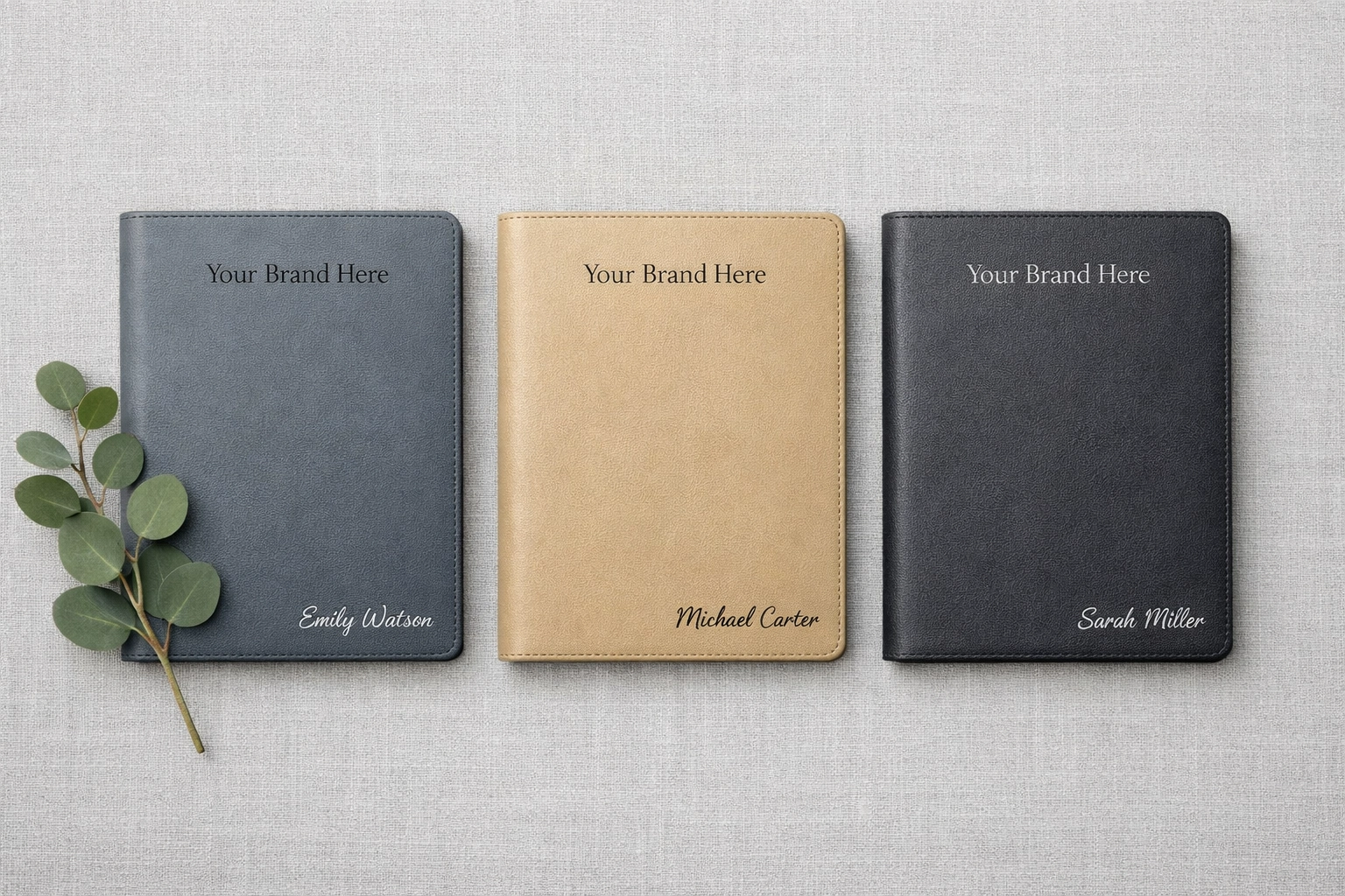 Personalized laser engraved vegan leather journals in neutral tones for high-quality corporate gifting.