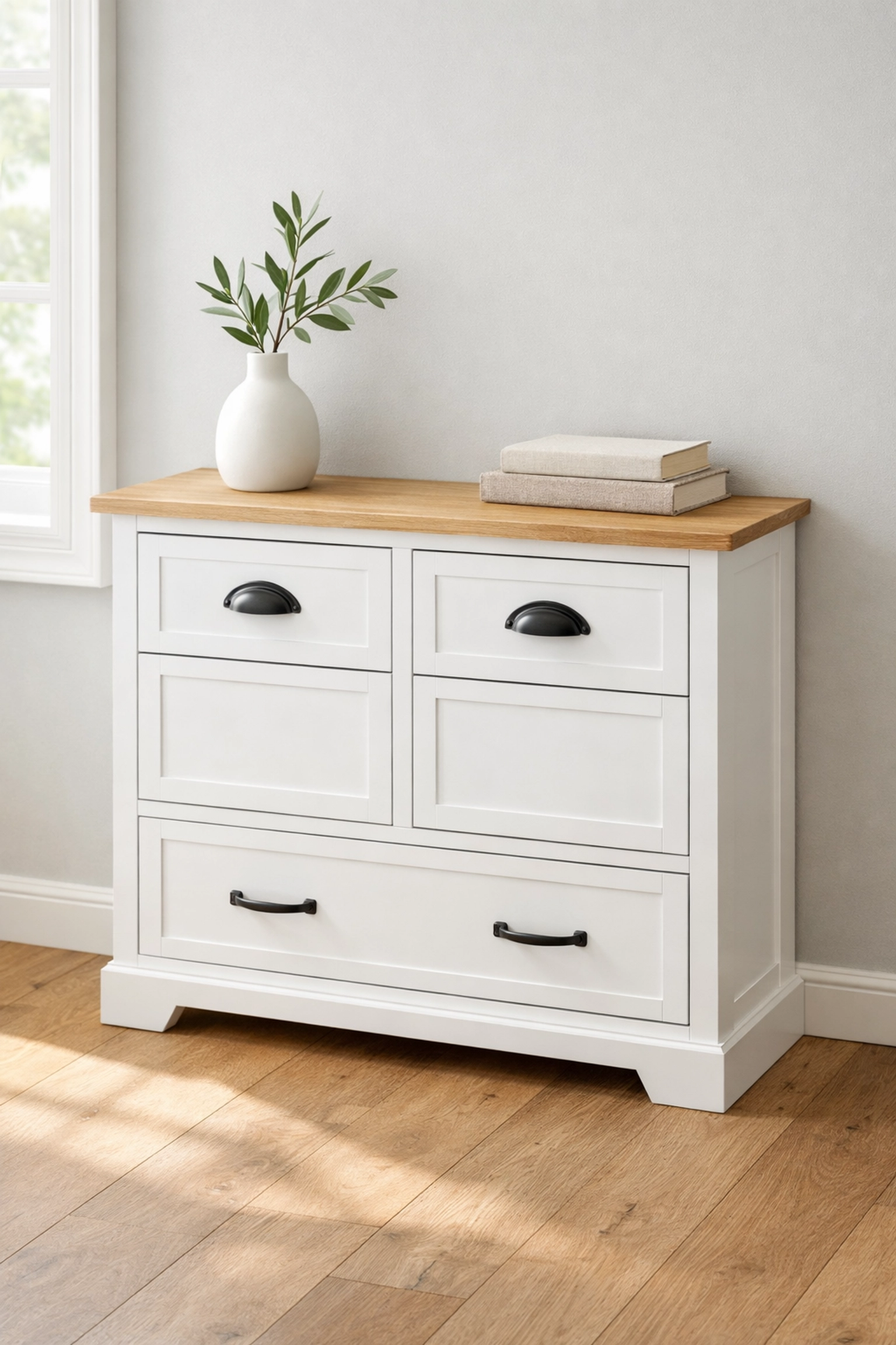 White farmhouse tilt-out kitchen cabinet used as a functional storage workstation in a bright, sun-drenched kitchen.