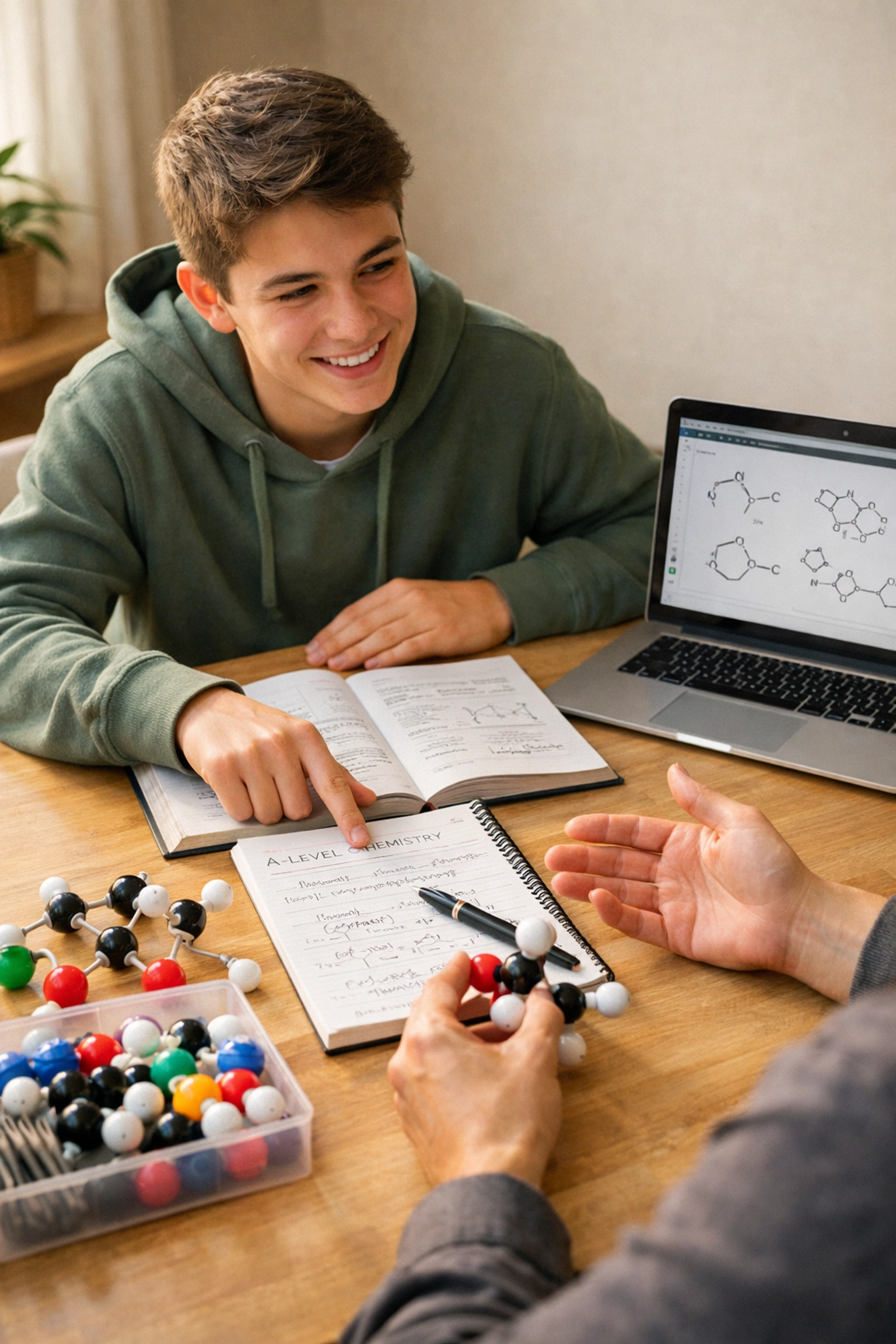 One-to-one chemistry tutoring session with student and tutor reviewing molecular structures