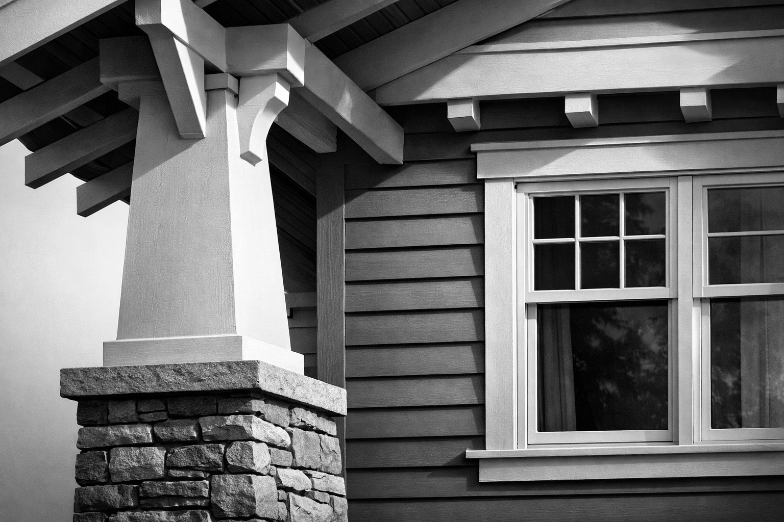 Classic Craftsman porch with tapered columns and exposed rafters in Chattanooga