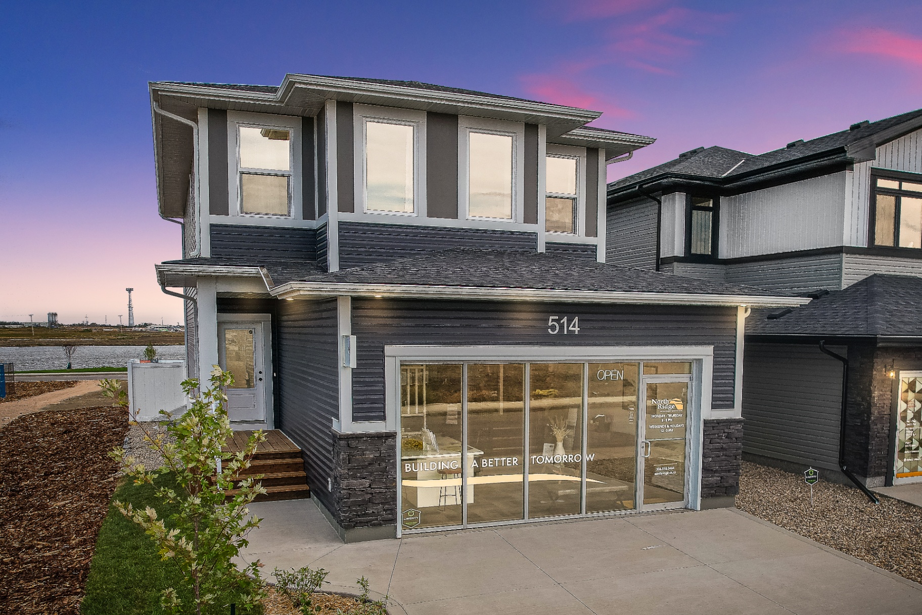 Twilight exterior photo of a modern two-story show home