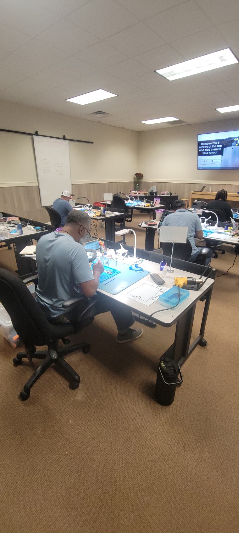 Mobile Device Repair Training Students