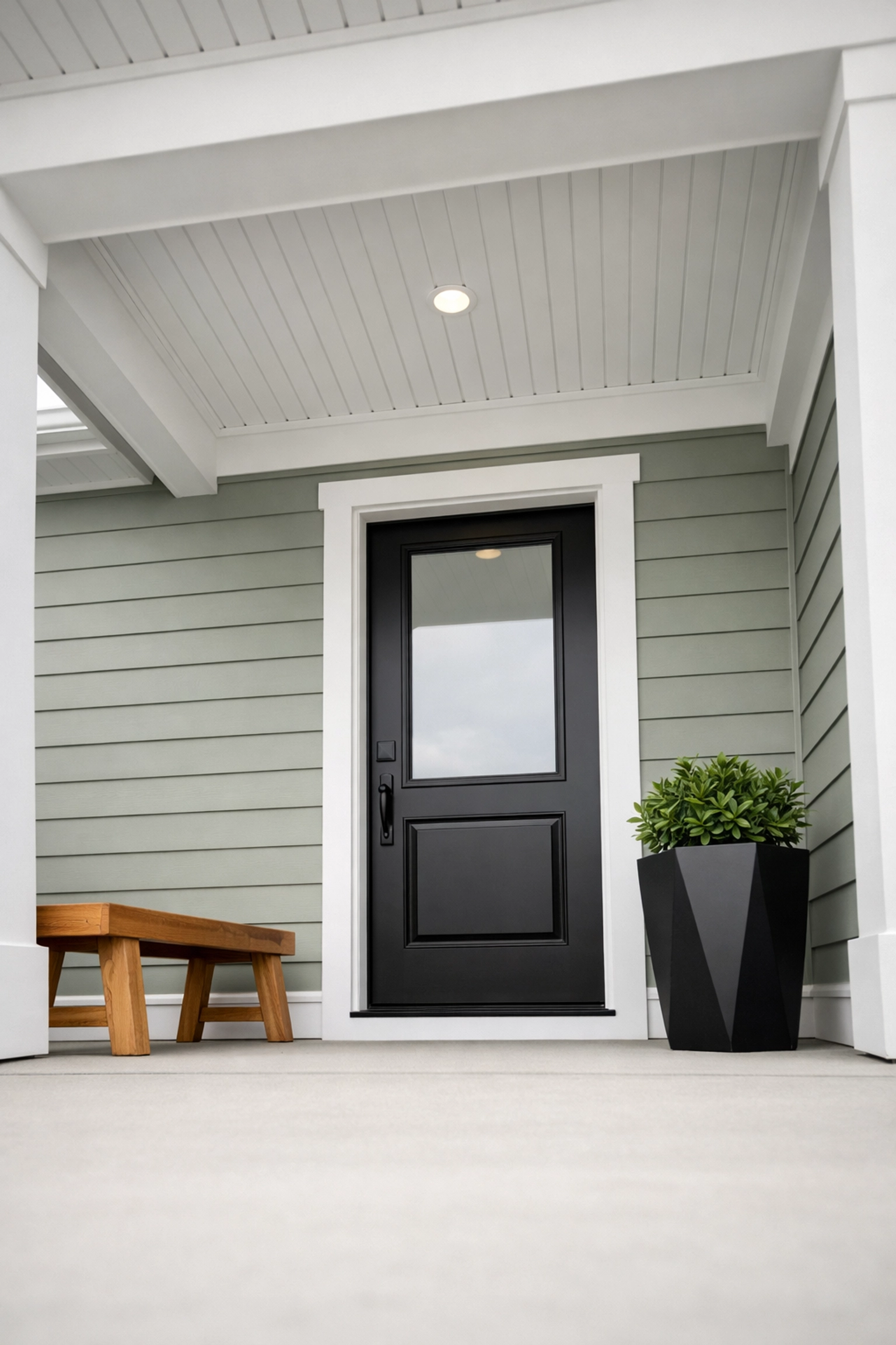 Modern front porch and black entry door of a Northeast Ohio home investment property.