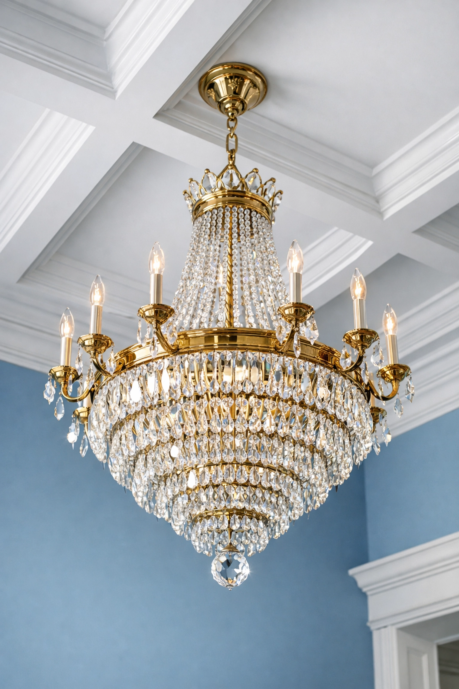 Sparkling clean crystal chandelier and coffered ceiling maintained by professional Hingham estate cleaning.