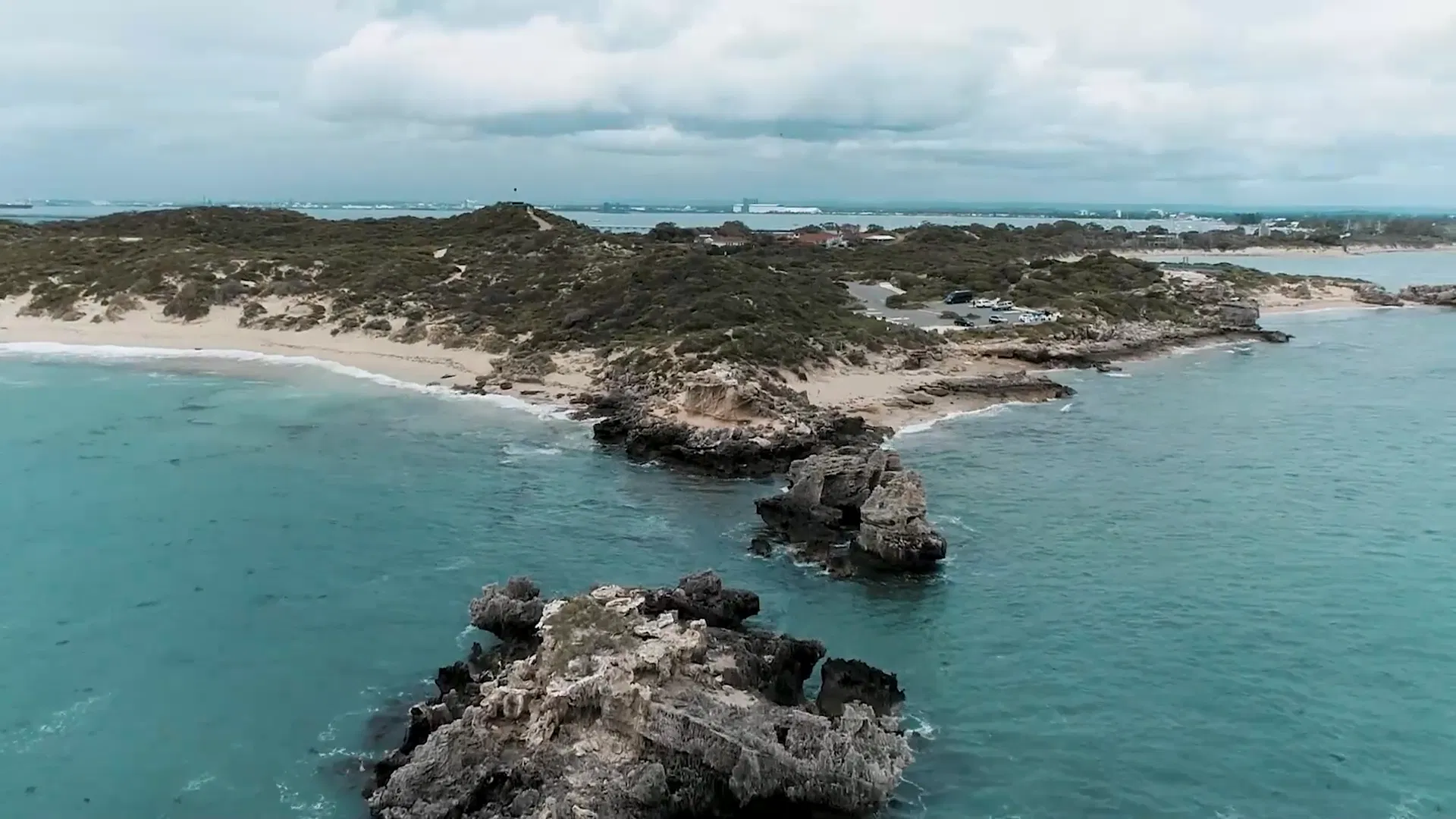 rugged-coastline-turquoise-water-sandy-beaches-rocky-outcrops-cars-drone-bunbury
