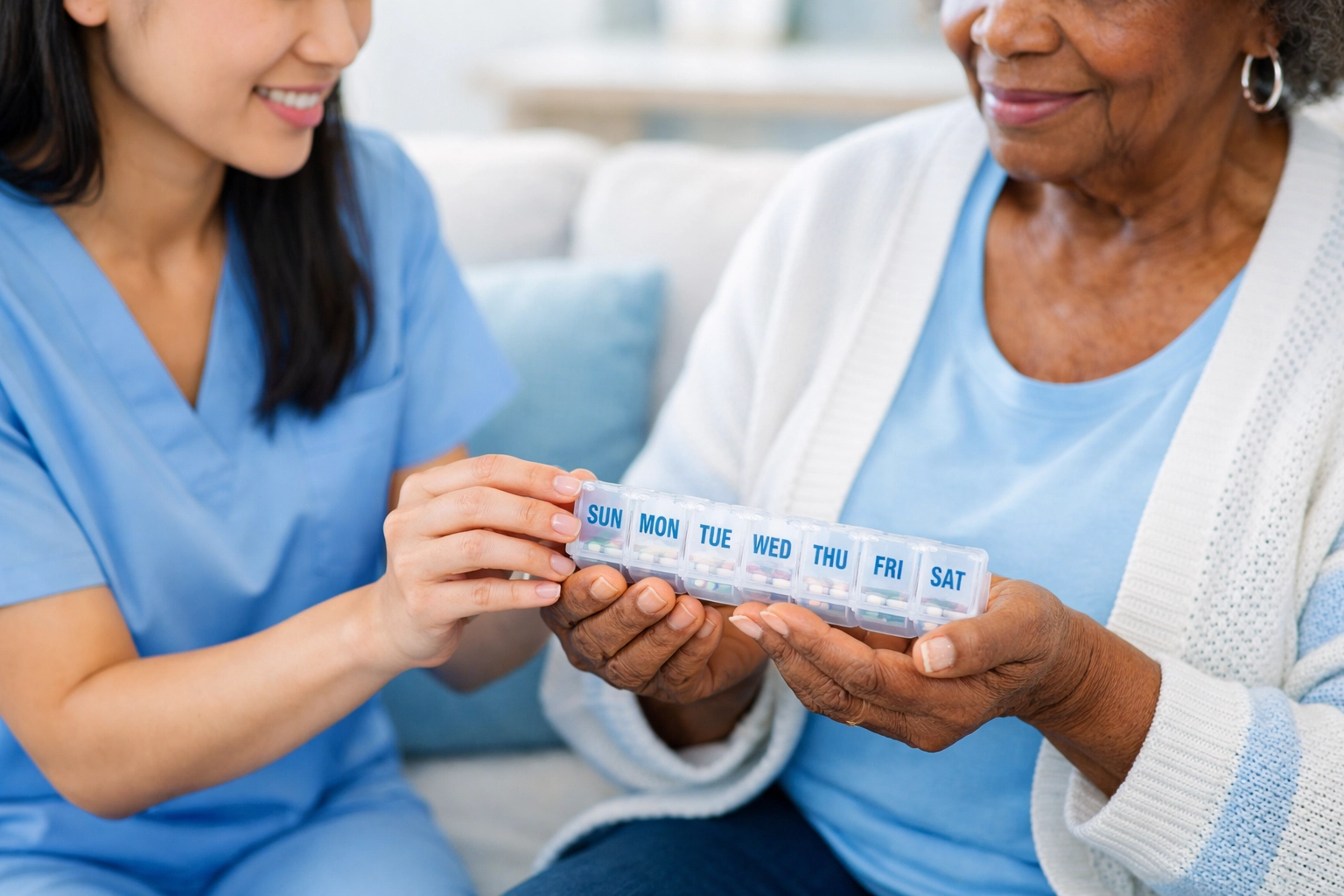 Caregiver hands medication organizer for medication reminders during in-home care for seniors