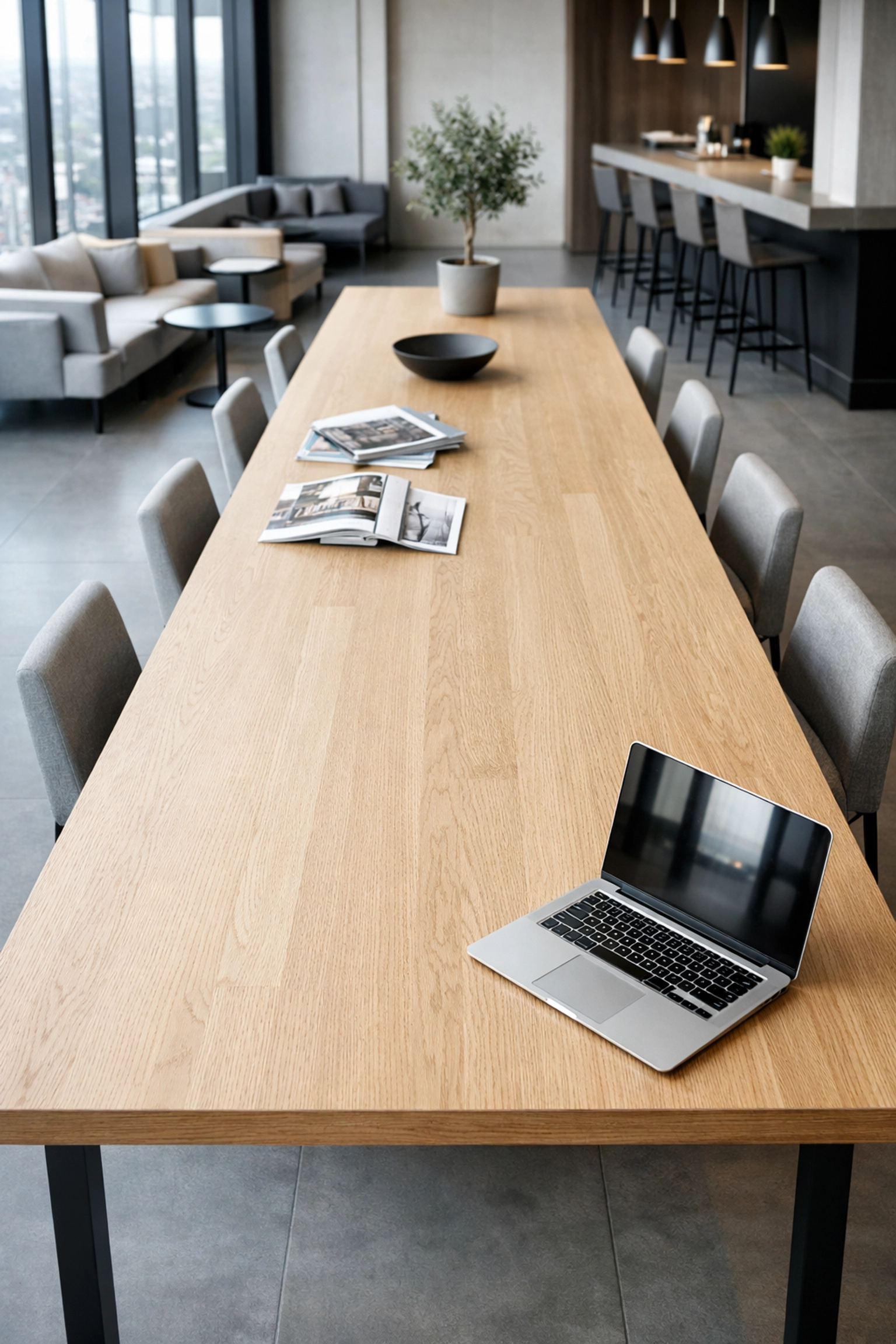 Modern hotel co-working space with minimalist design and tech-enabled tools for efficient hotel management.