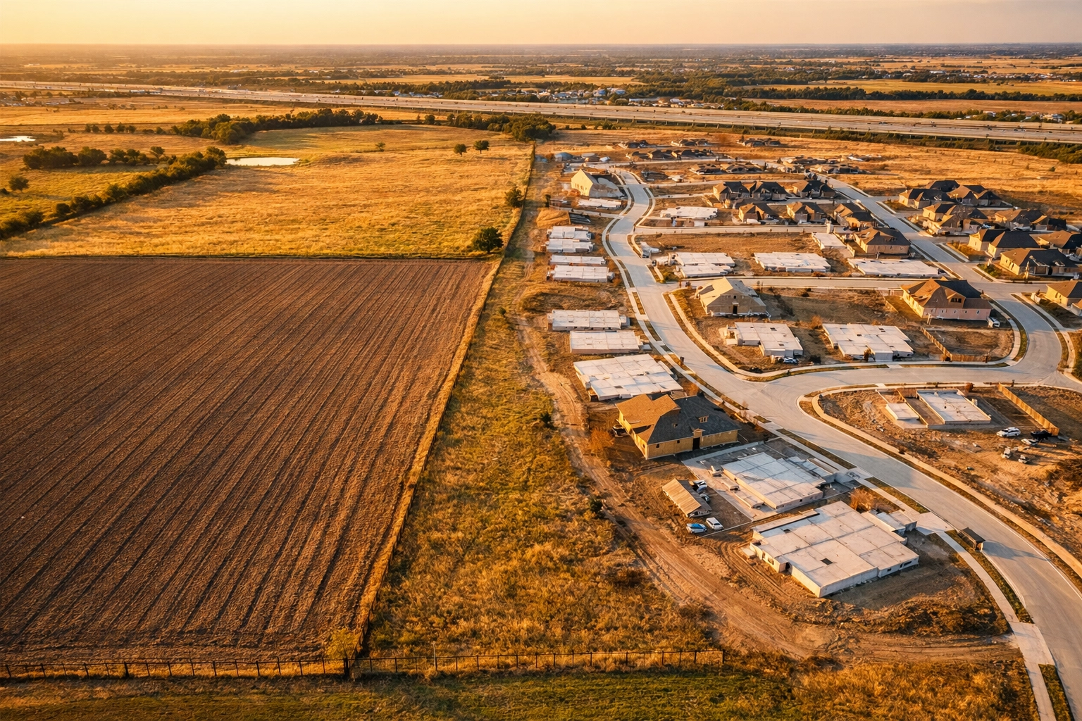 Aerial view of agricultural land transitioning to residential development in North Texas