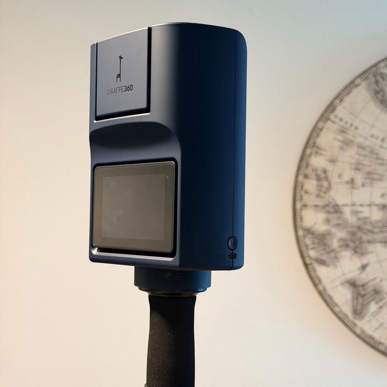 Giraffe 360 Camera on a tripod in a modern luxury home for high-end real estate marketing.