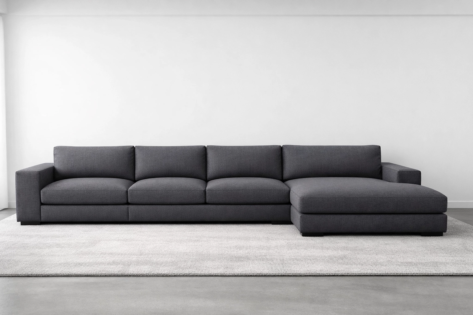 Modern custom upholstered sectional sofa with clean seams in a professionally designed living room.