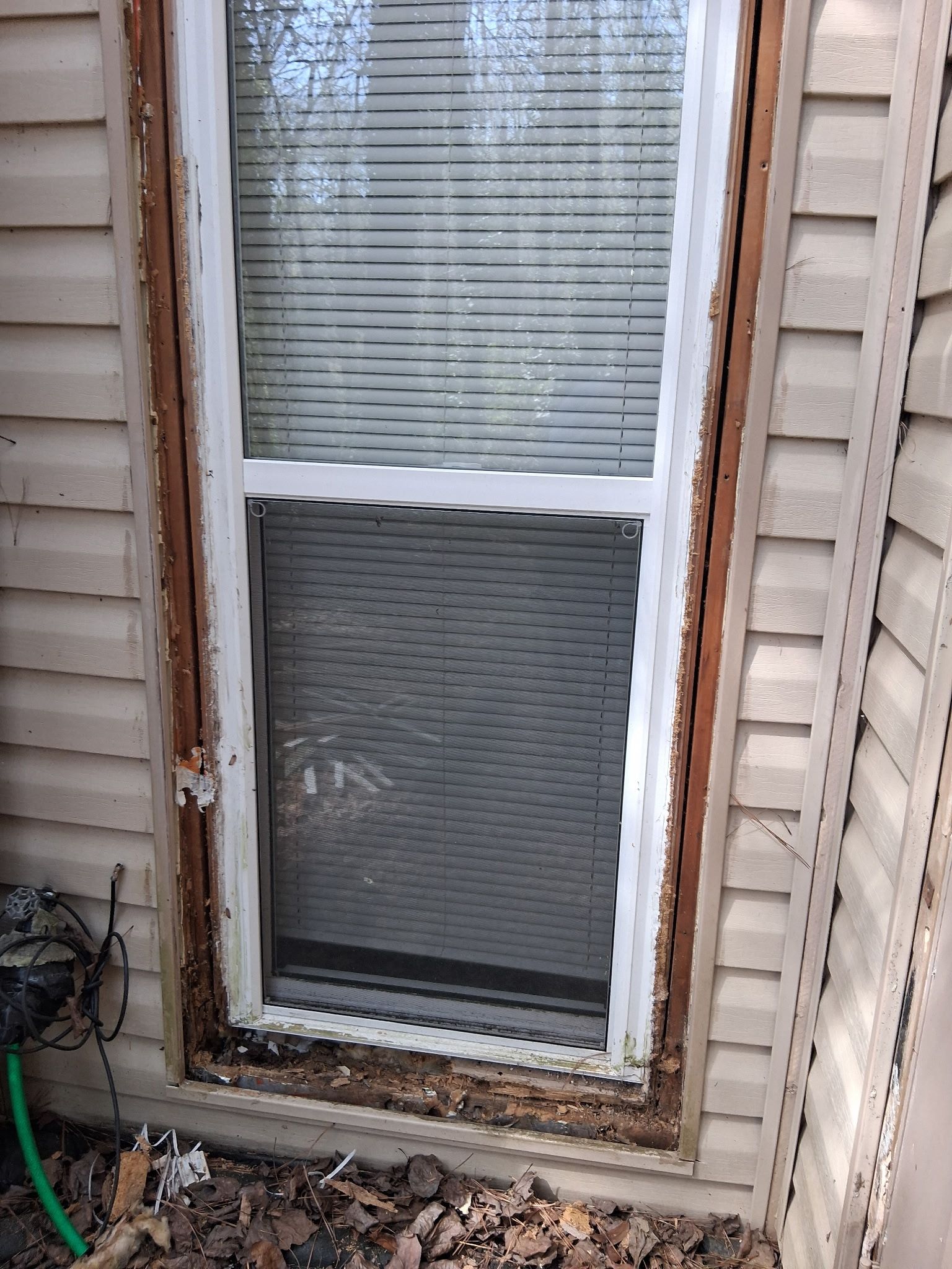 Inspection photo showing moisture damage and deteriorated wood components on the exterior of an Atlanta rental home