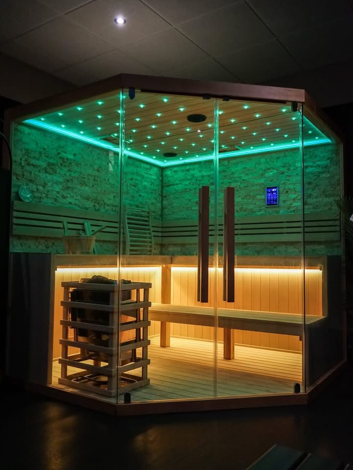 Traditional sauna interior at The Wellness Lounge, showcasing a spacious wooden heat room designed for restorative recovery sessions.