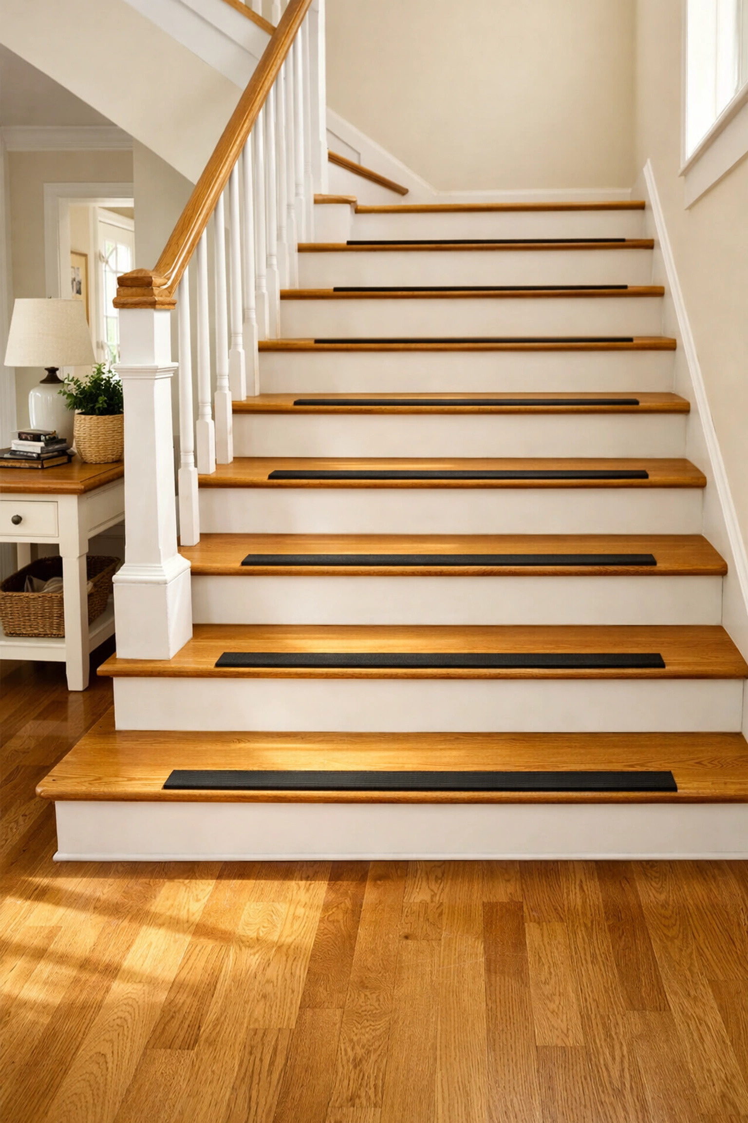 Clean staircase with non-slip adhesive strips and no tripping hazards or clutter.