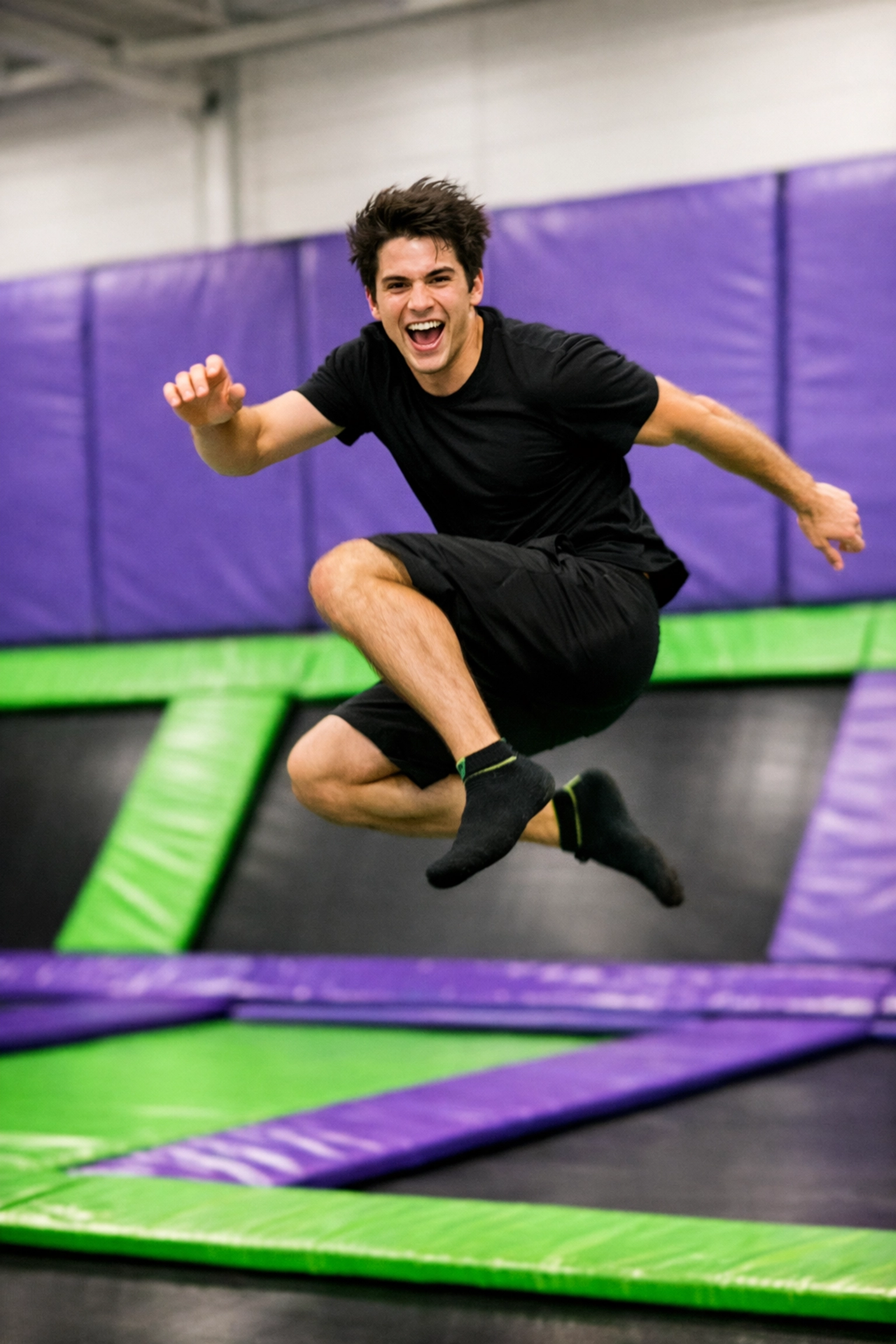 Jumping at an indoor trampoline park in Montreal, a fun rainy-day activity for kids and adults to stay warm.