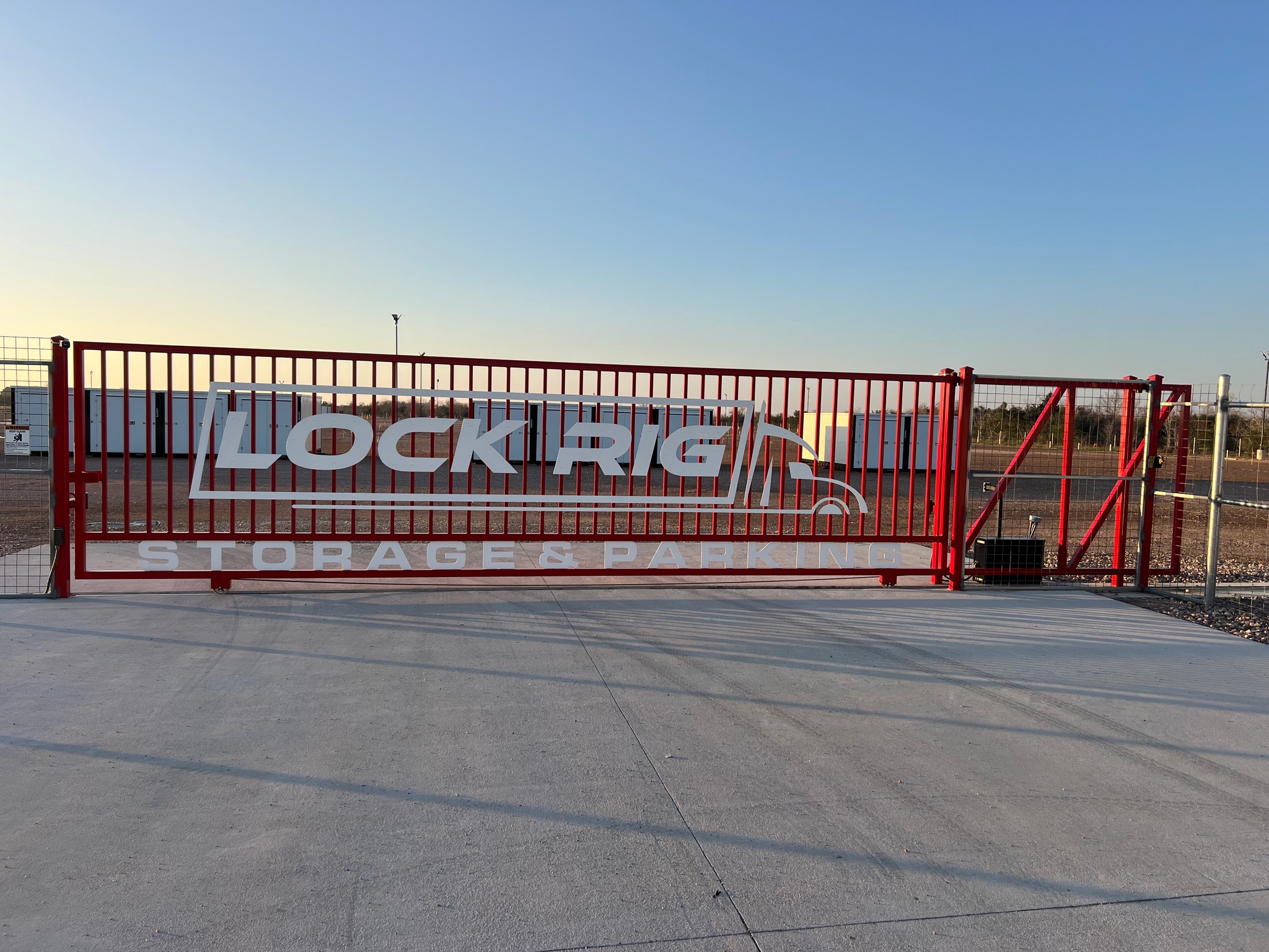 Secure gated entrance with perimeter fencing