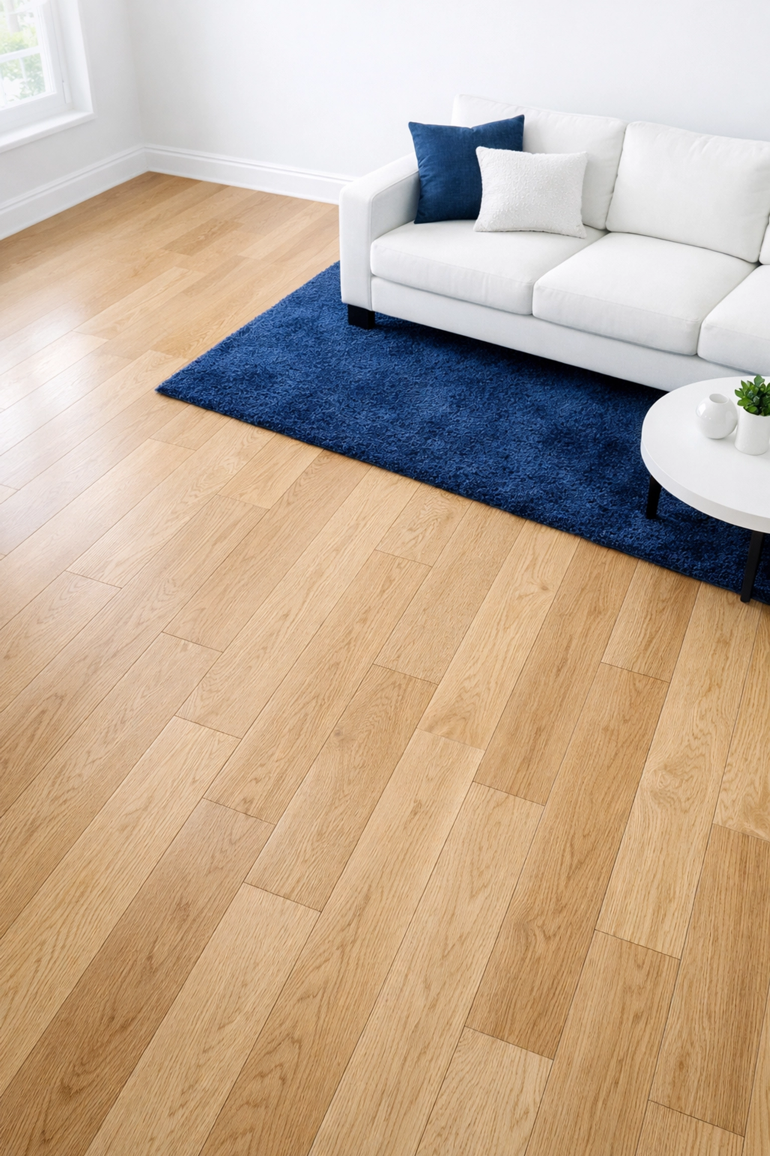 Dust-free hardwood floors and baseboards in a Walpole home after expert post construction cleaning services.