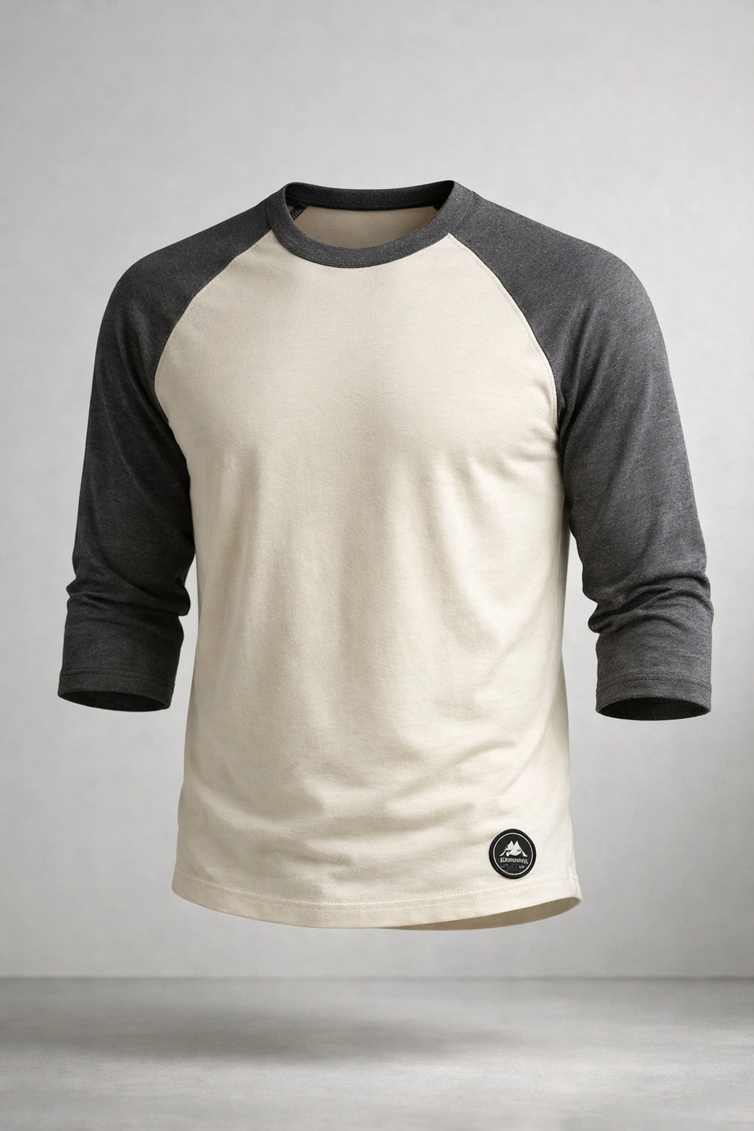 Premium custom raglan sleeve shirt with charcoal sleeves and diagonal stitching for athletic movement.