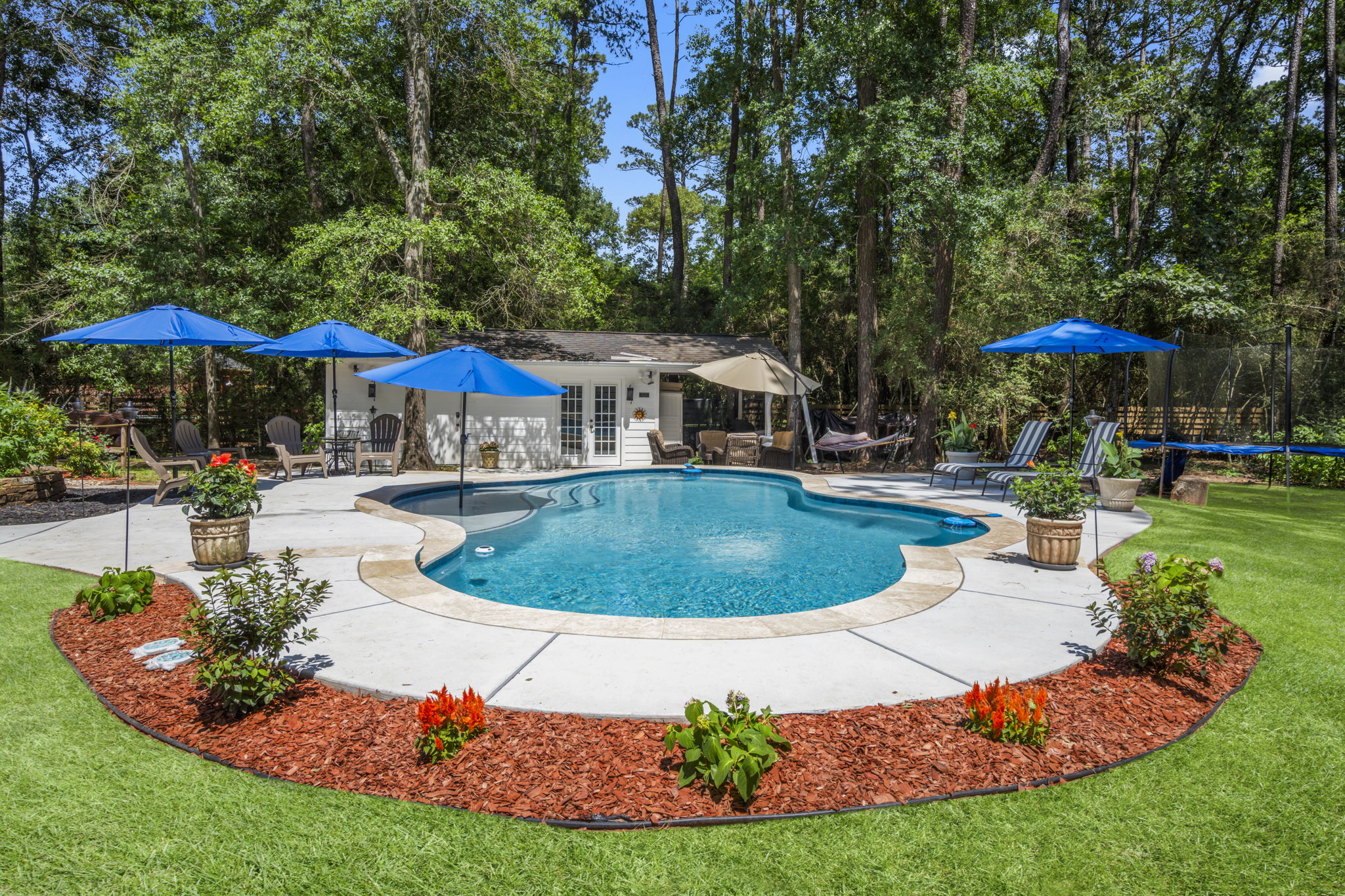 Spring sunshine on a custom pool with deck jets