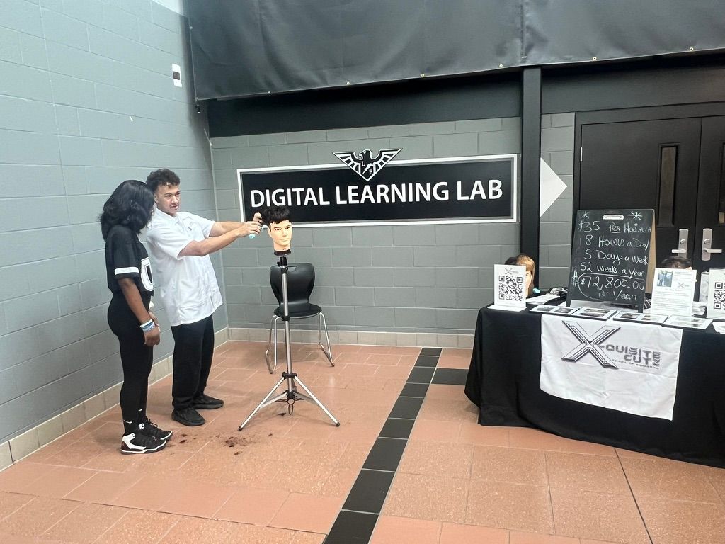 Lakota East Career Fair - Full Setup Wide shot of the X-Quisite Cutz setup at Lakota East Digital Learning Lab area.